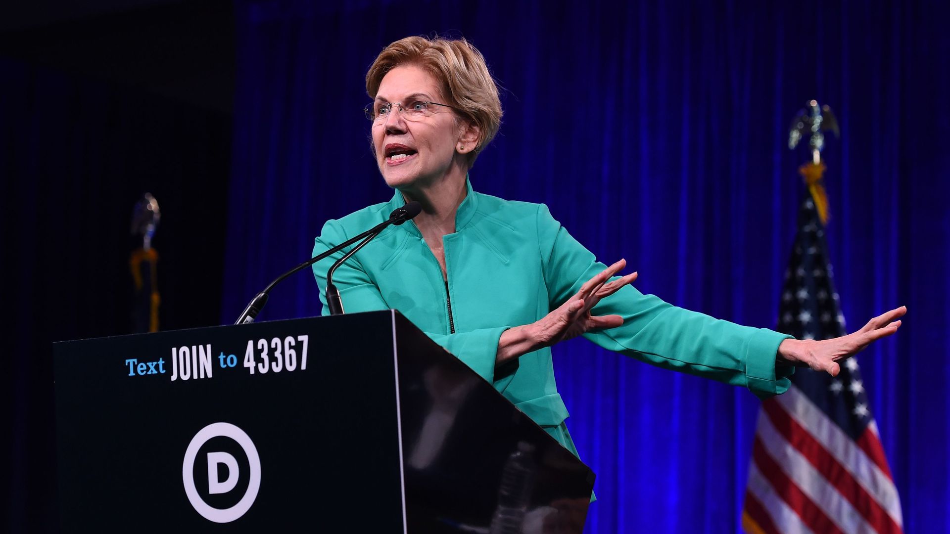 Democratic Presidential hopeful US Senator from Massachusetts Elizabeth Warren speaks on-stage during the Democratic National Committee's summer meeting in San Francisco
