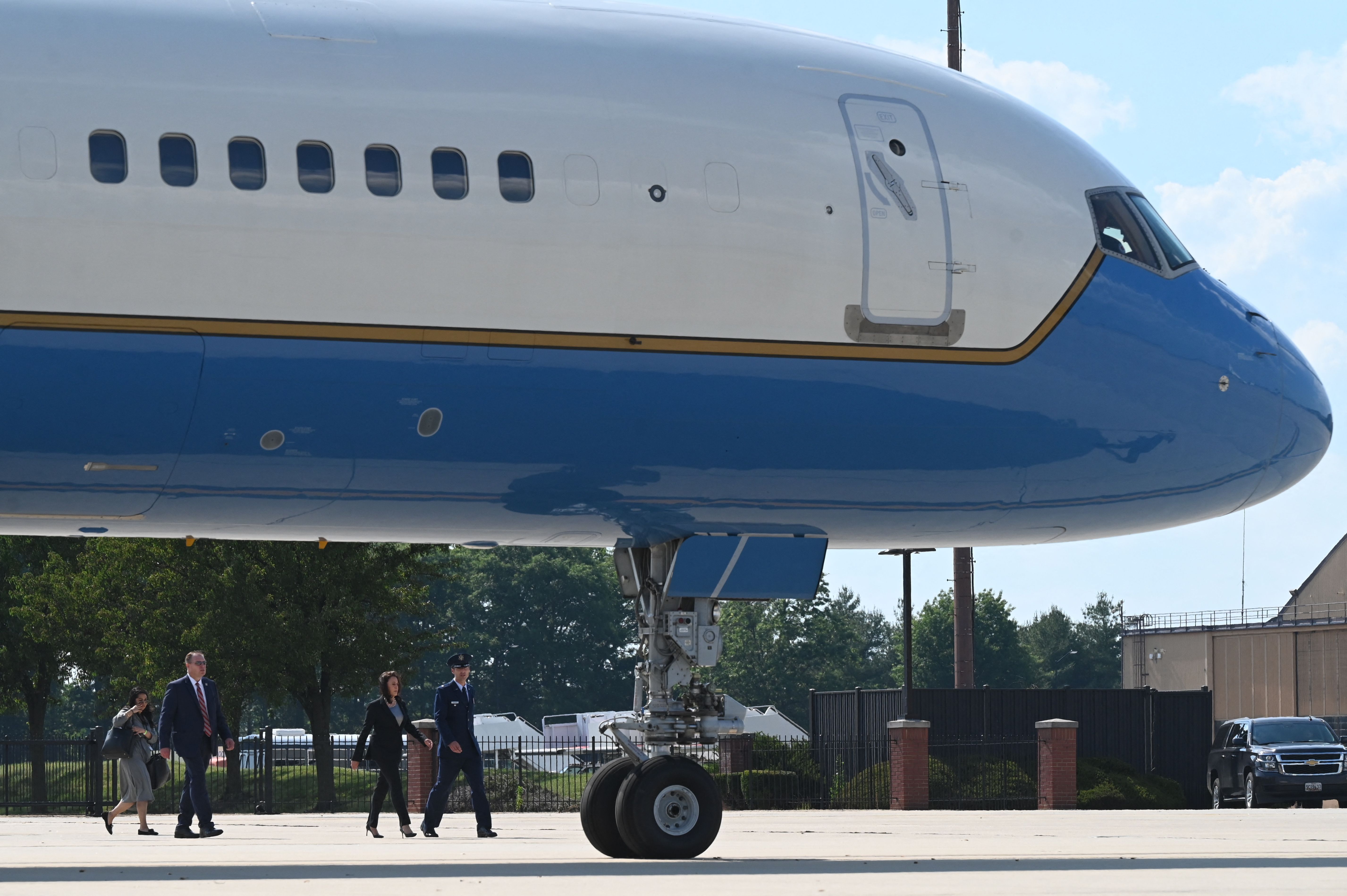 Vice President Kamala Harris is seen walking past a broken Air Force jet en route to Air Force Two.