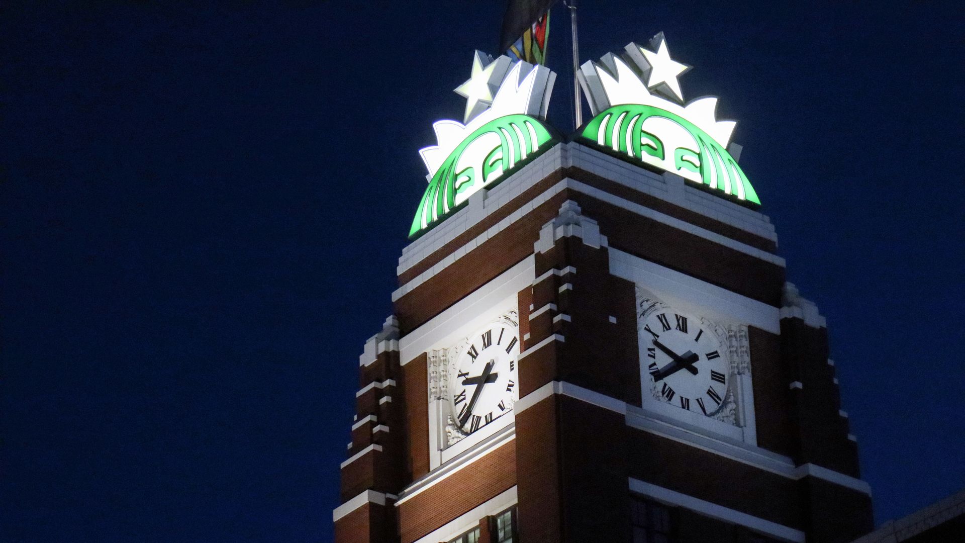The glowing mermaid tower at the top of the Starbucks headquarters building in Seattle.