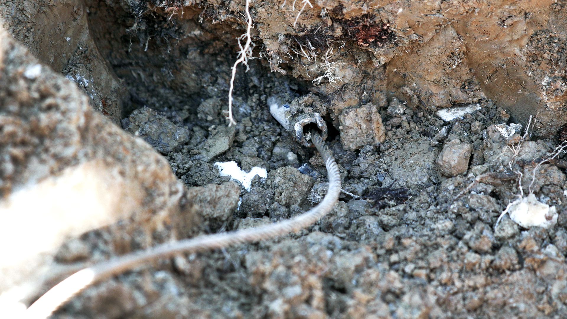 a lead service line is exposed in Flint, Michigan