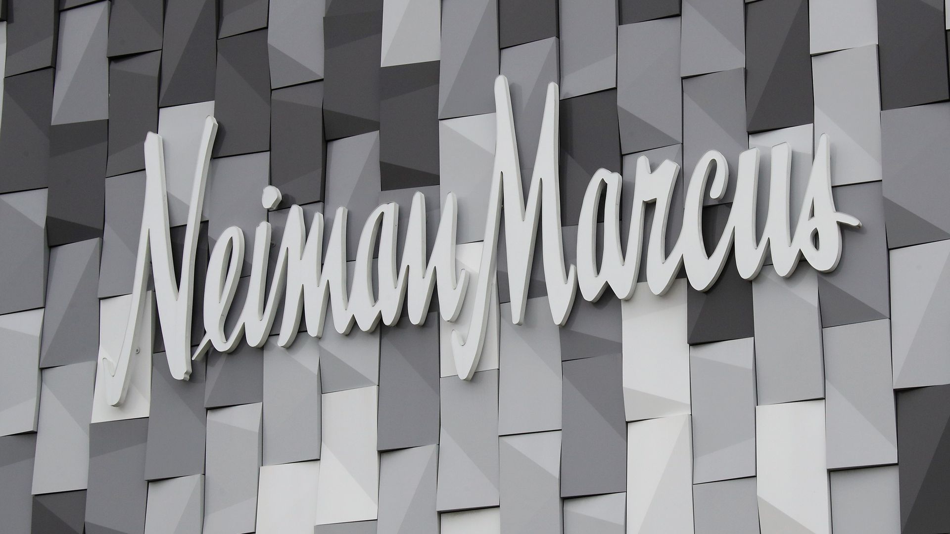 A Neiman Marcus storefront banner.