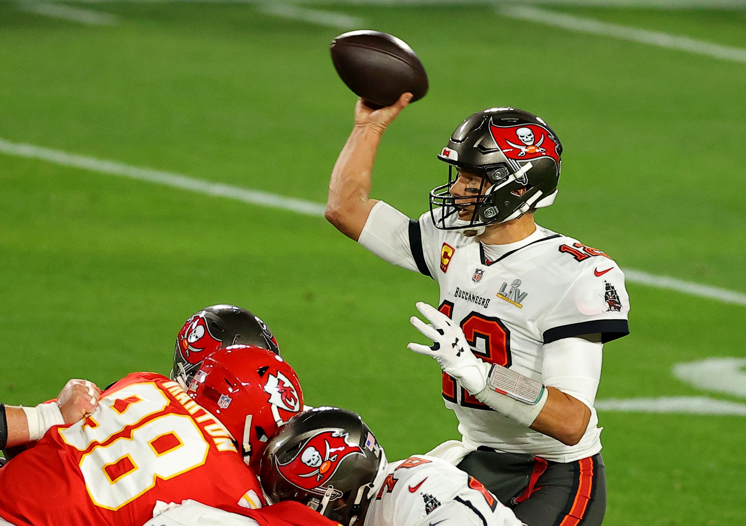 : Tom Brady #12 of the Tampa Bay Buccaneers looks to pass during the second quarter against the Kansas City Chiefs in Super Bowl LV at Raymond James Stadium on February 07, 2021 in Tampa, Florida. 