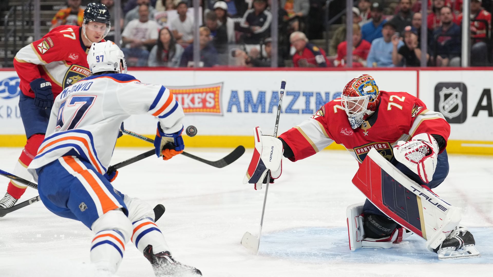 SUNRISE, FL - FEBRUARY 27: Edmonton Oilers center Connor McDavid (97) charges for the rebound after a save by Florida Panthers goaltender Sergei Bobrovsky (72) in the third period during the game between the Edmonton Oilers and the Florida Panthers on February 27, 2025 at Amerant Bank Arena in Sunri