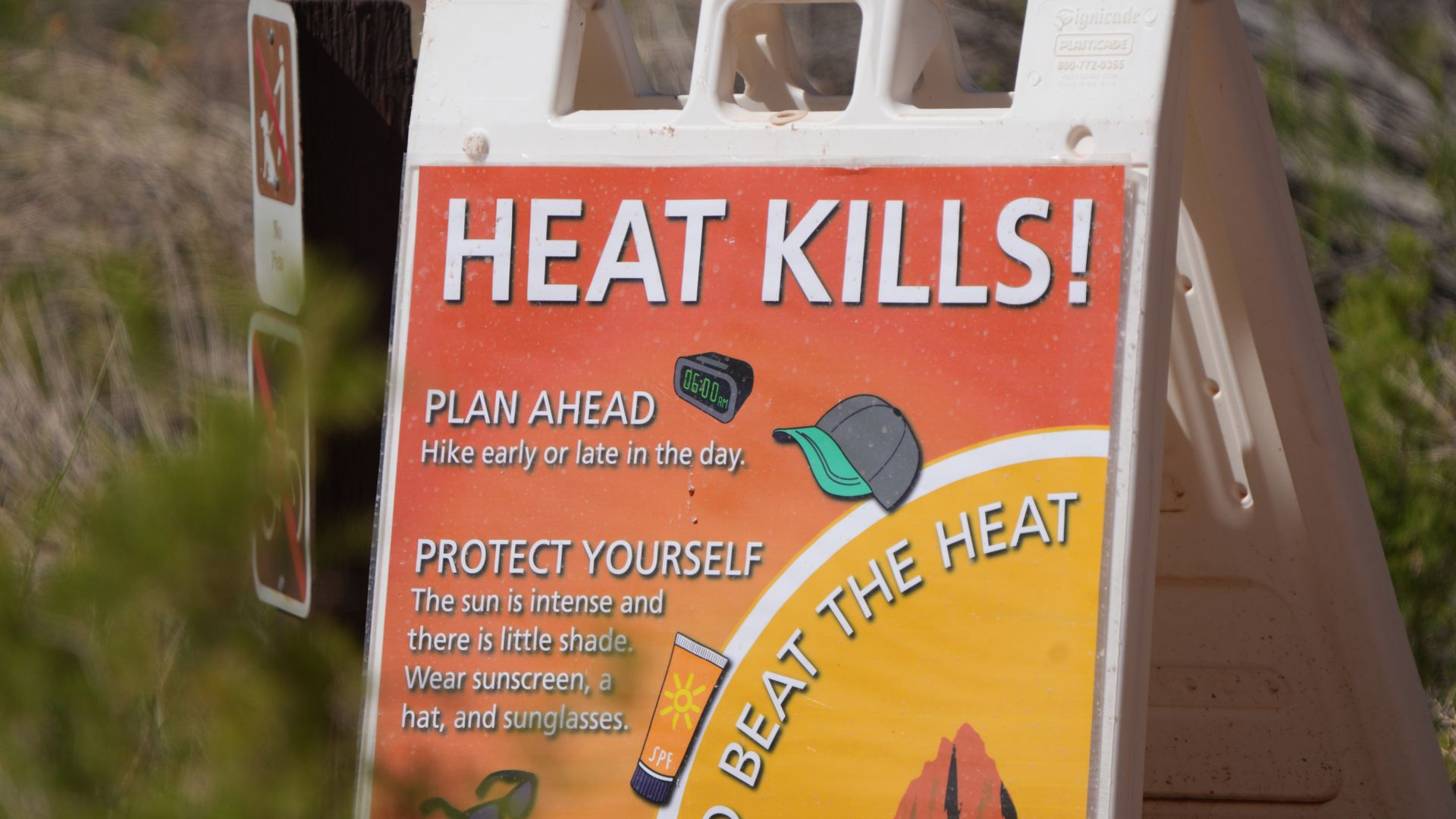 Photo of a sign that says "Heat kills! Plan ahead, protect yourself, beat the heat"