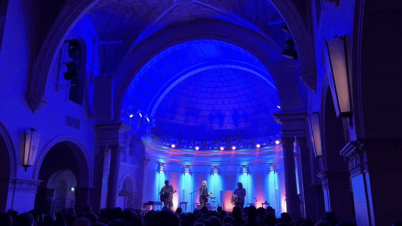 A band performs in a church building. 