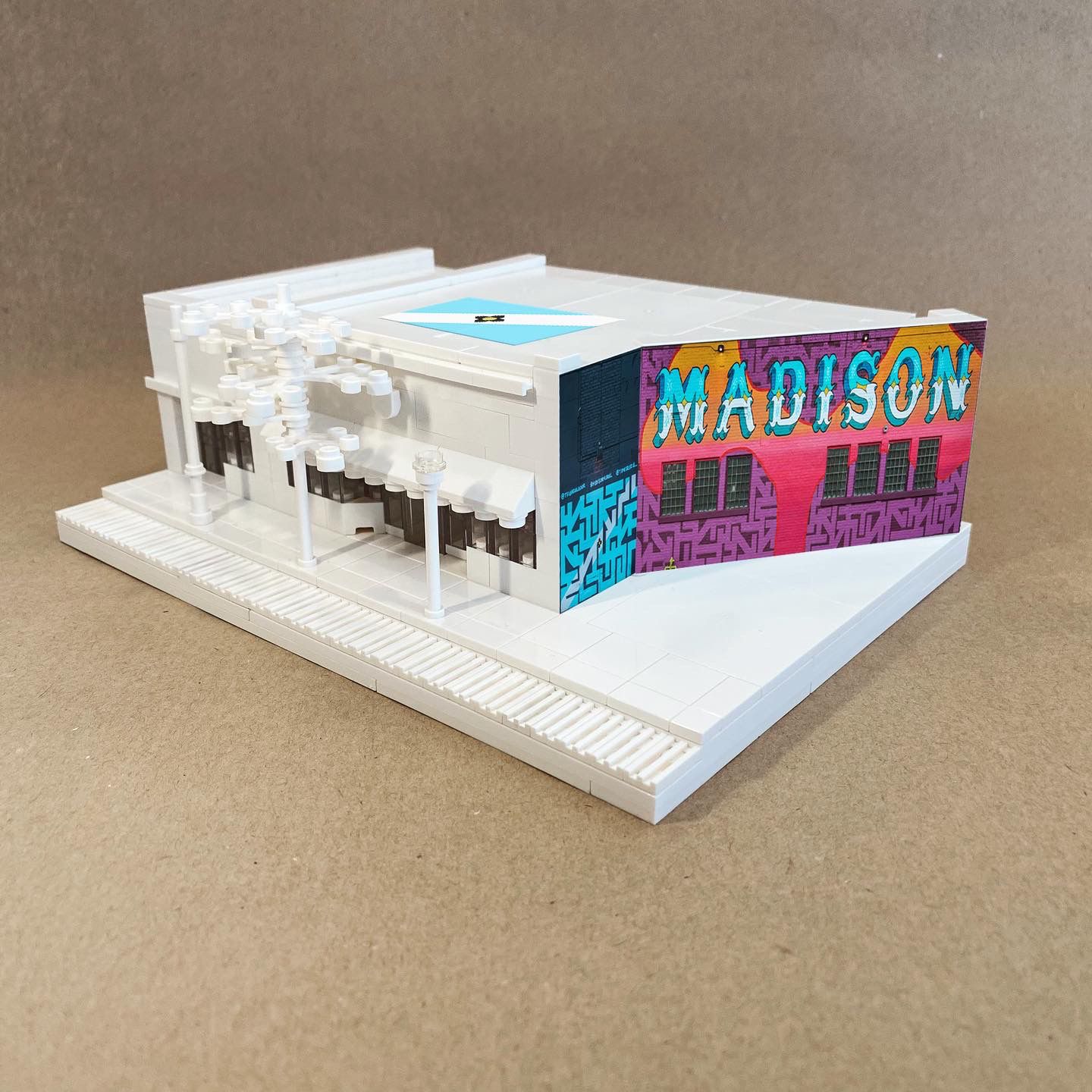 A Lego version of the Lauer Realty + Triangulador Mural building in Madison, Wisconsin.