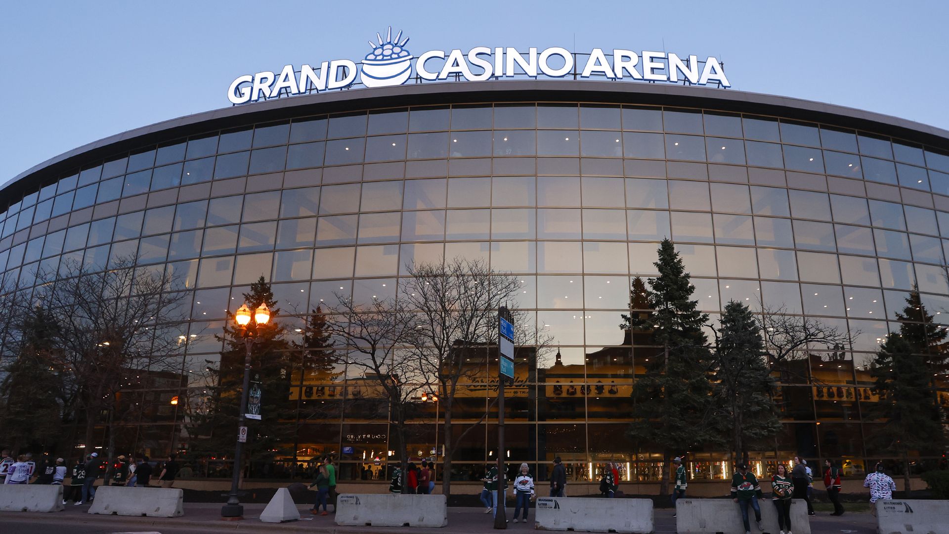 Outside of Grand Casino Arena with a sign