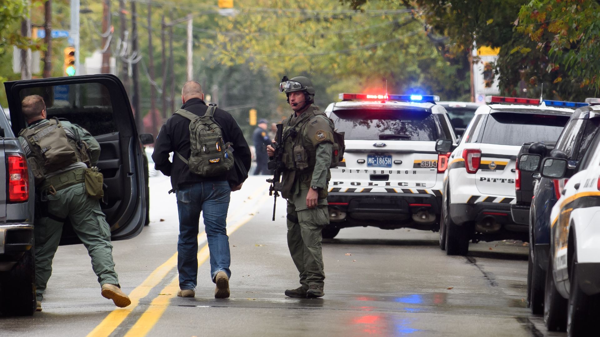Men in SWAT gear standing in the road outside the Pittsburgh shooting in the synagogue. 