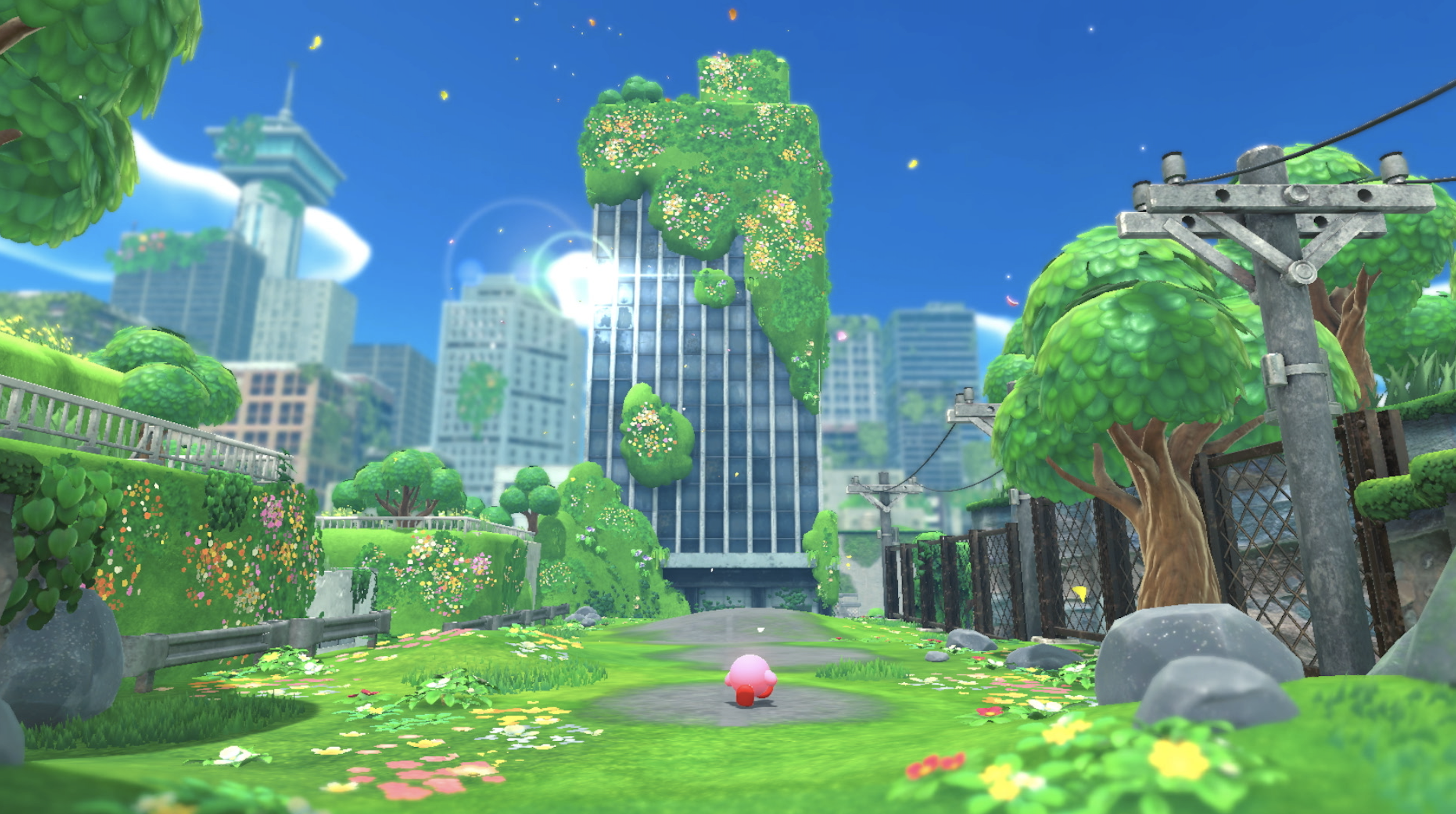 Video game image of a round, pink character walking into a city with skyscrapers covered in overgrown plants