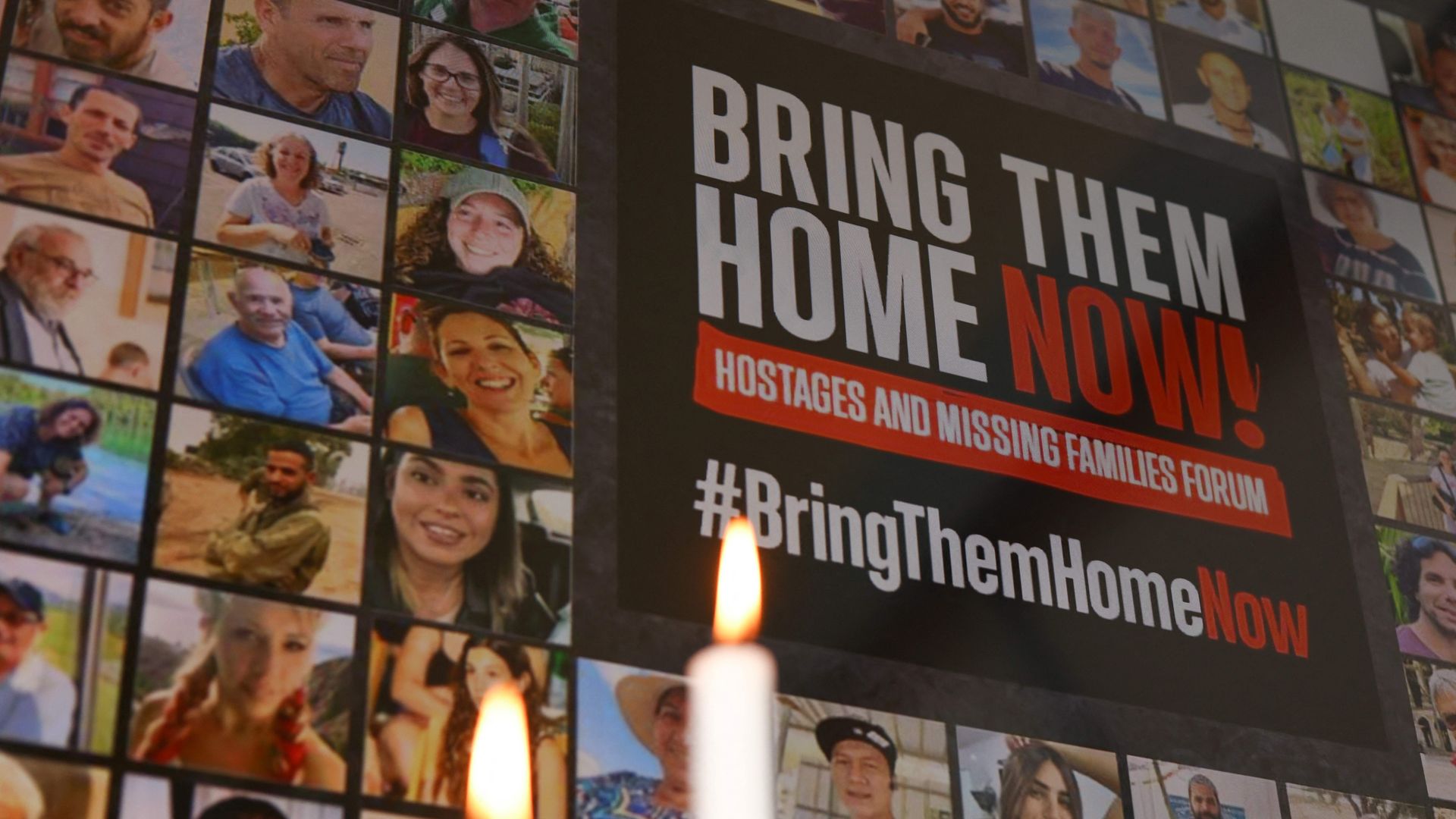 This photograph taken in Brussels on October 26, 2023 shows a poster and candles displayed during a press conference organised by Europe Israel Press Association with families of Israelis killed or held captive by the Palestinian Islamist movement Hamas. 