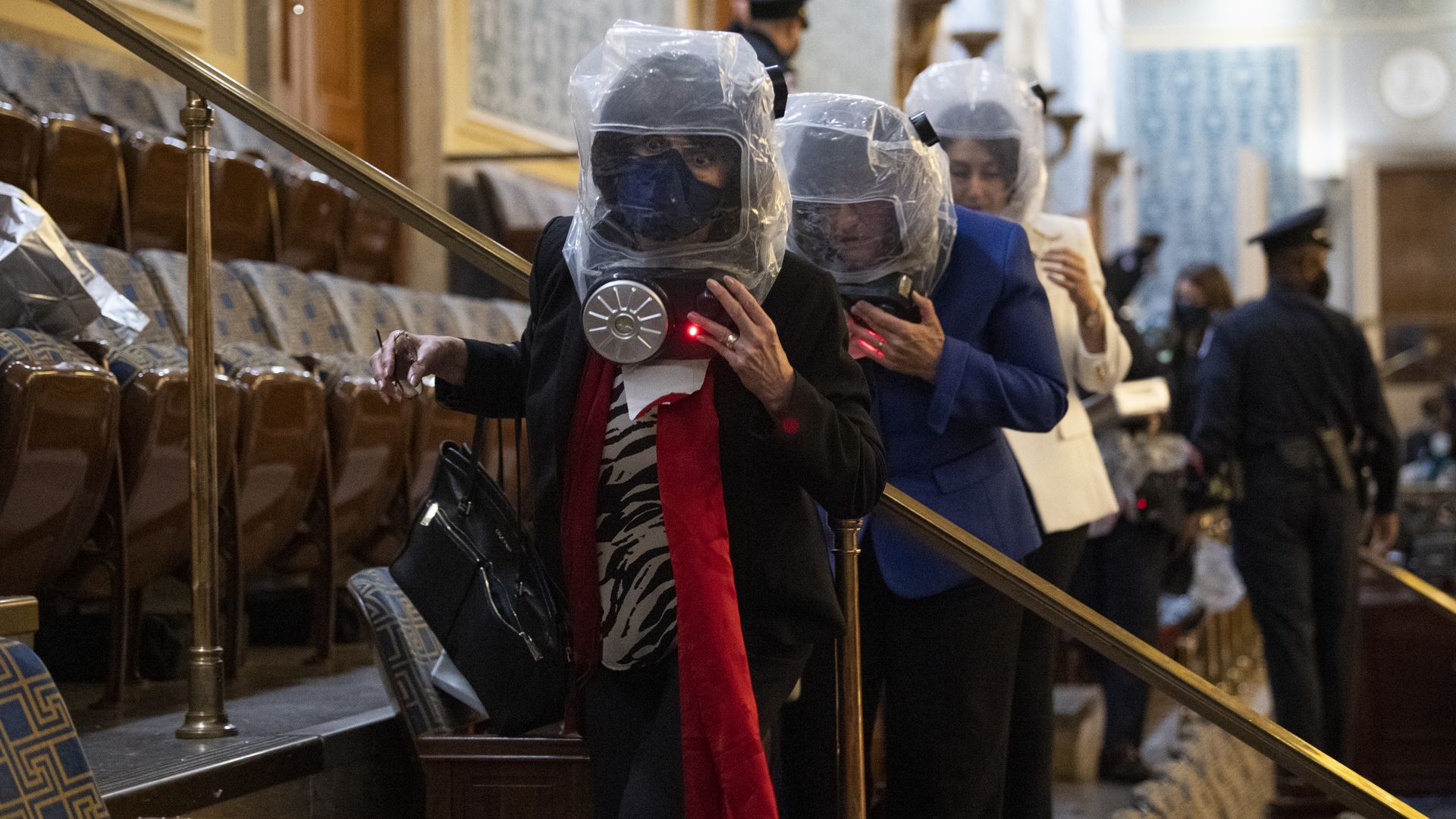 Rep. Annie Kuster is seen with other members of Congress fleeing the Capitol seige on Jan. 6.