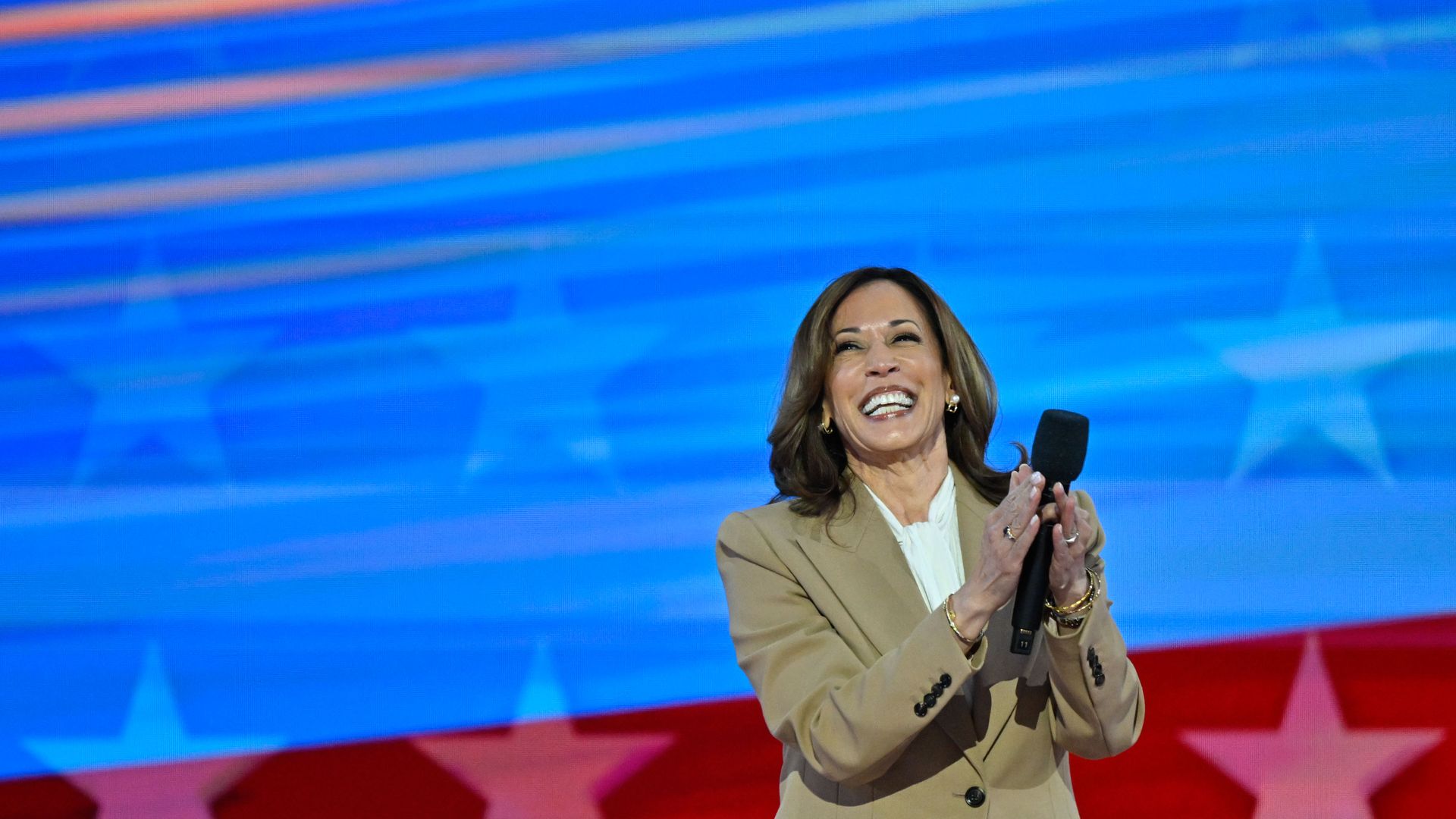 Democratic presidential nominee Vice President Kamala Harris walks on stage during the first day of the Democratic National Convention on August 19, 2024, at the United Center in Chicago, Illinois.