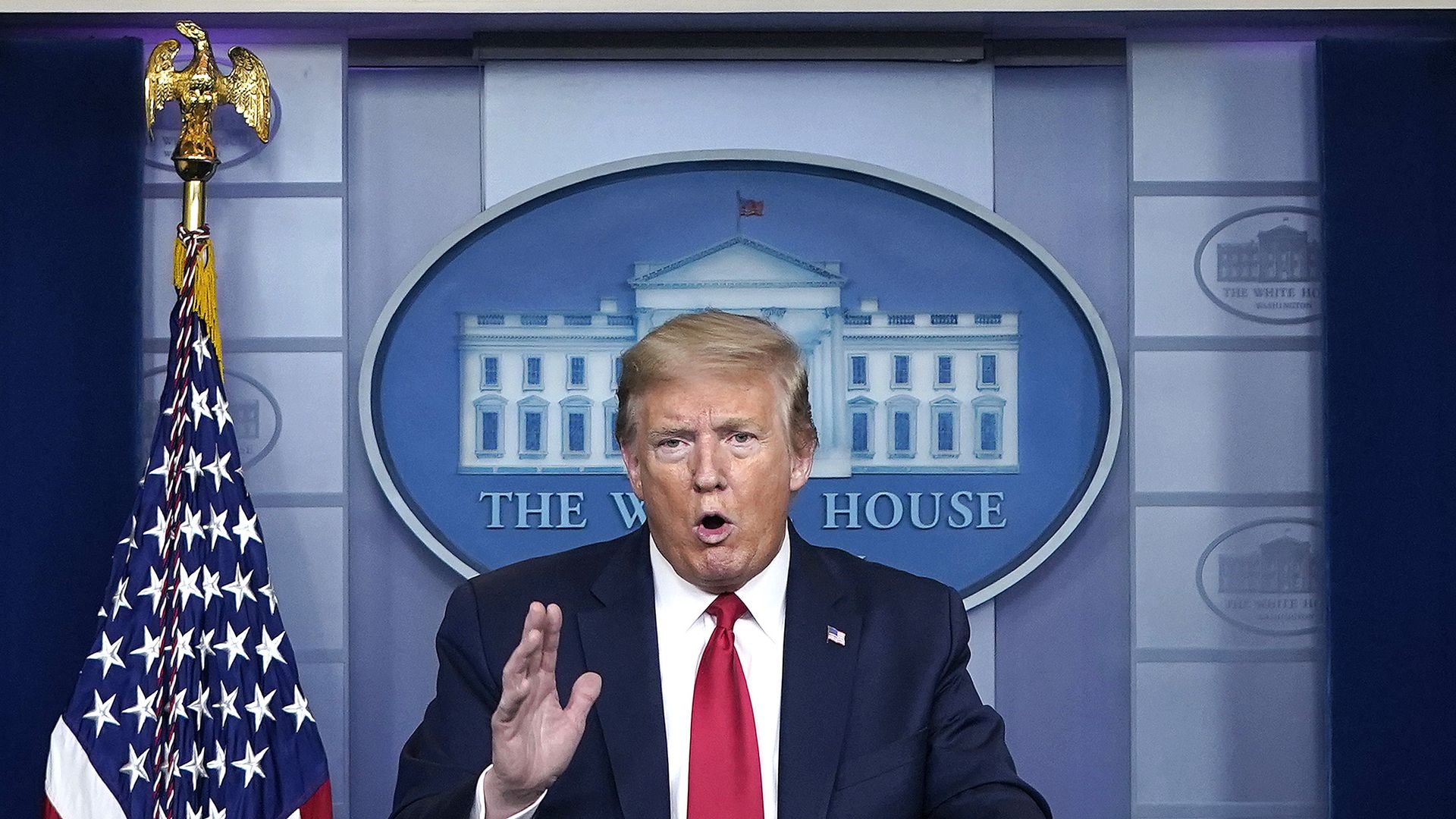 Donald Trump speaking in the White House press briefing room. 