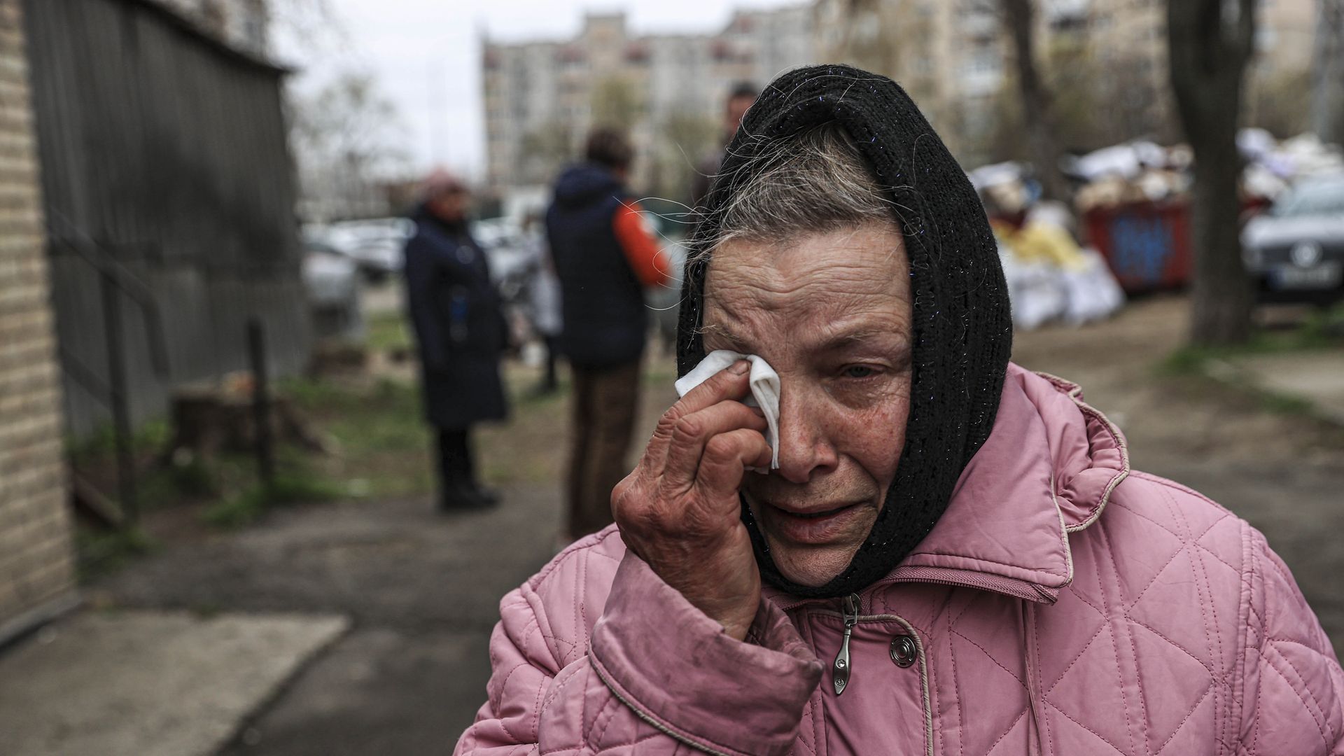 A relative, mourning, is seen as the burial of civilians allegedly killed by Russian troops continues at Bucha cemetery in Kyiv Oblast, Ukraine on April 20, 2022.