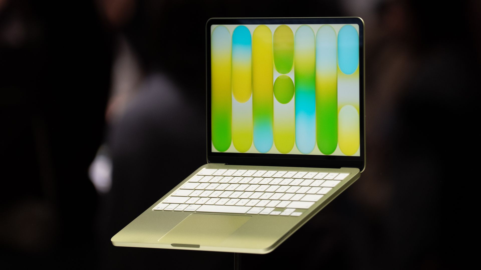 A citrus-colored Apple MacBook Neo laptop on display at an Apple event in New York on March 4, 2026.