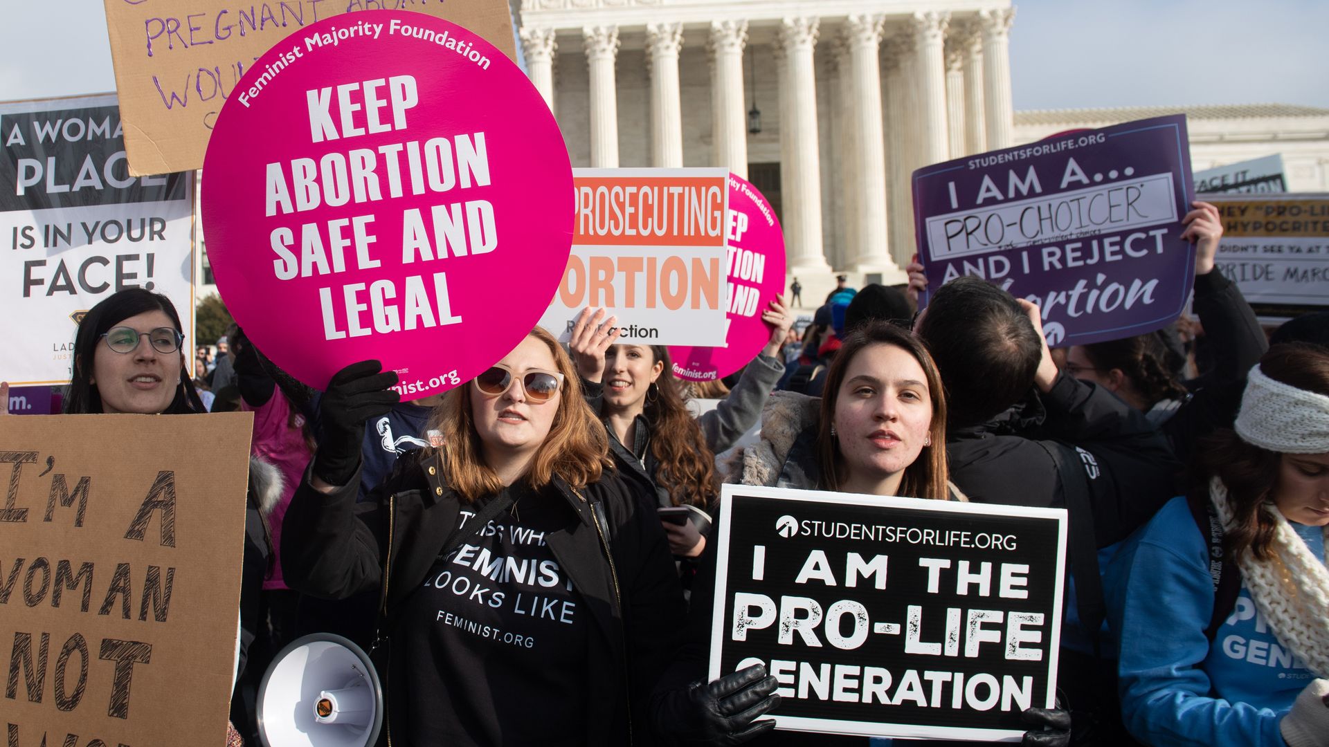 Pro-choice and anti-abortion activists protesting outside the U.S, Supreme Court. 