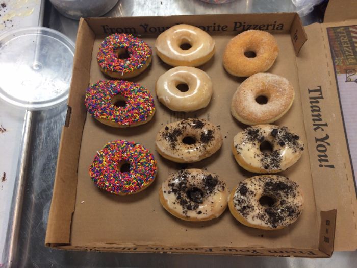The finished product—sprinkles, vanilla glaze, cinnamon-sugar and cookies 'n' cream
