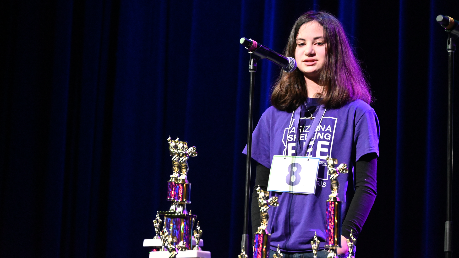 A girl at a microphone.