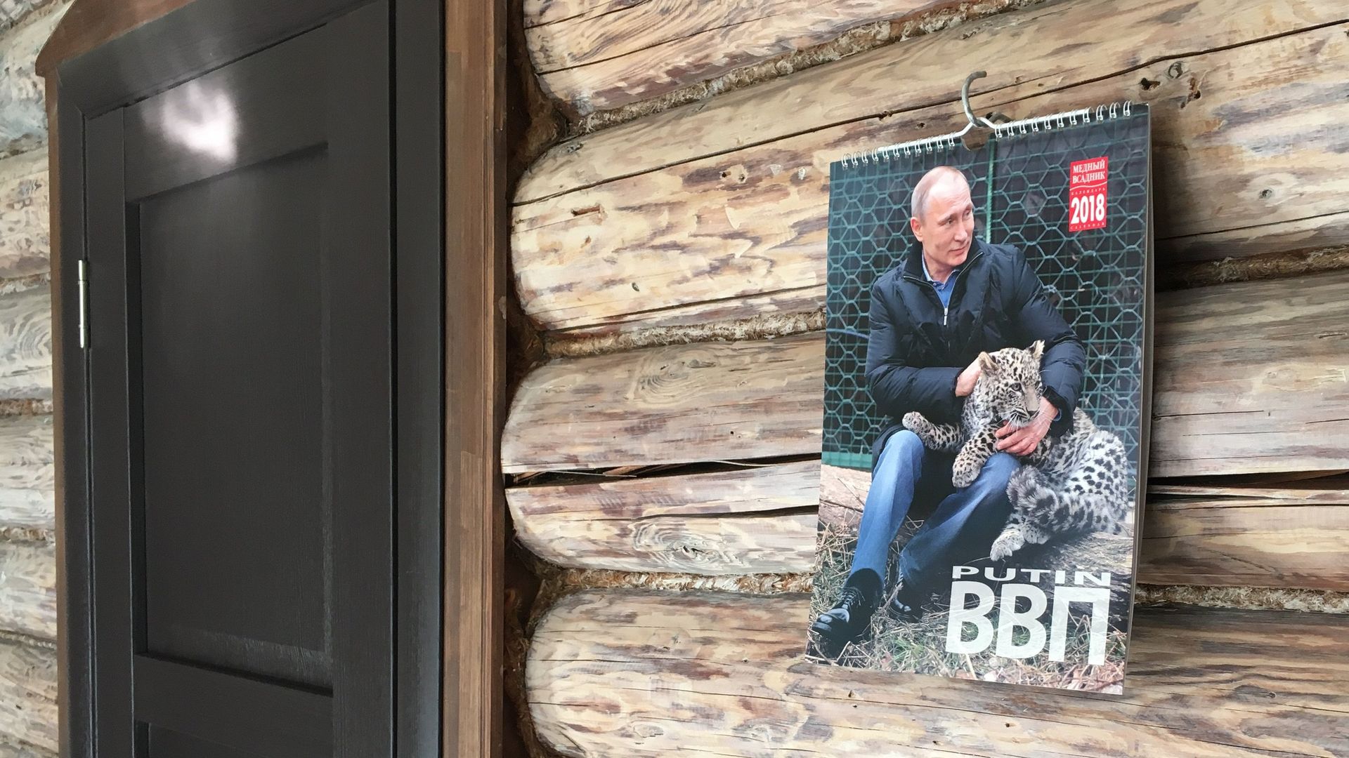 A calendar with photos of the Russian President Vladimir Putin is hanging on a wall in Moscow, Russia