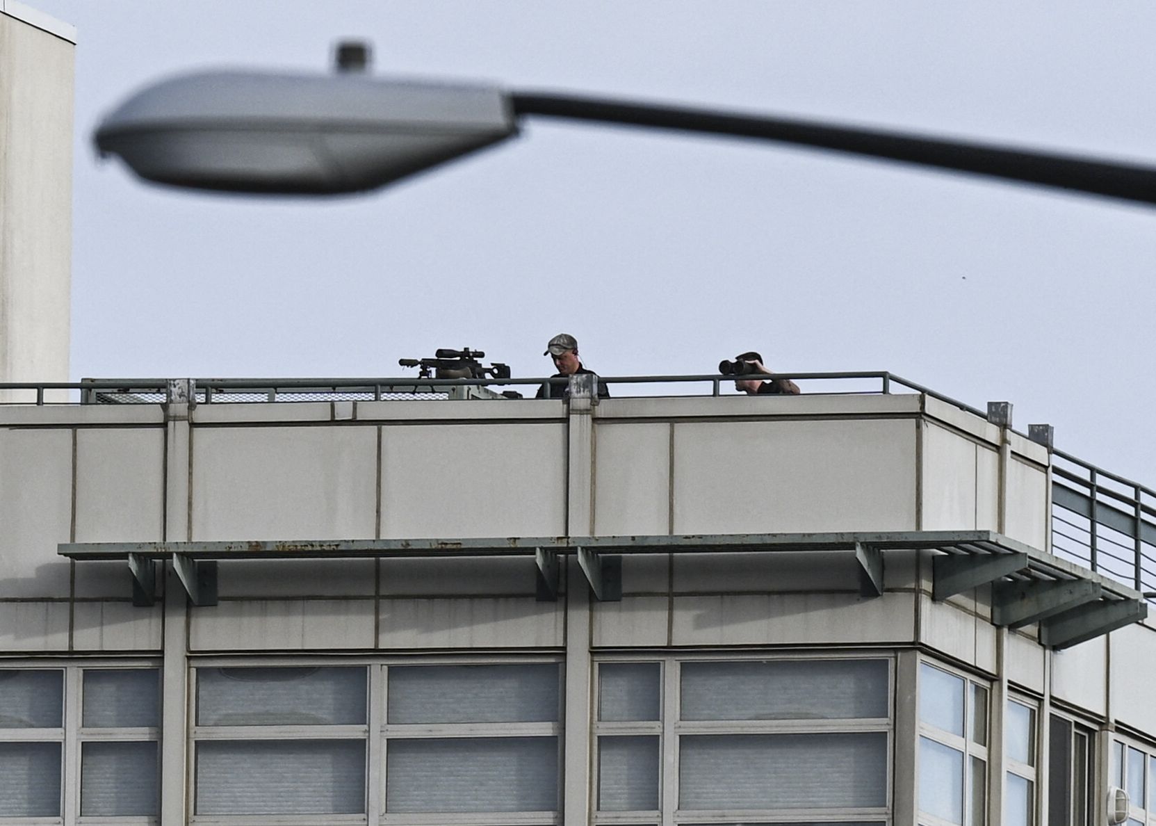 Police snipers on the roof of a building at the Van Ness shooting scene. 