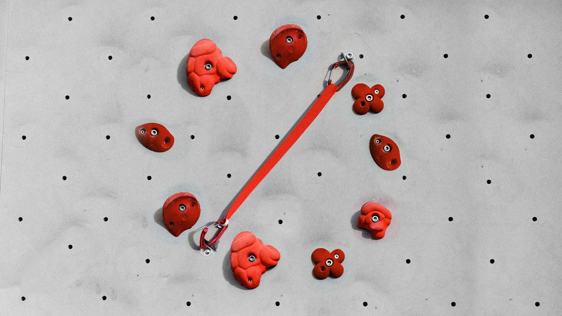 Illustration of a no sign made of hand holds and a strap on a rock climbing wall.
