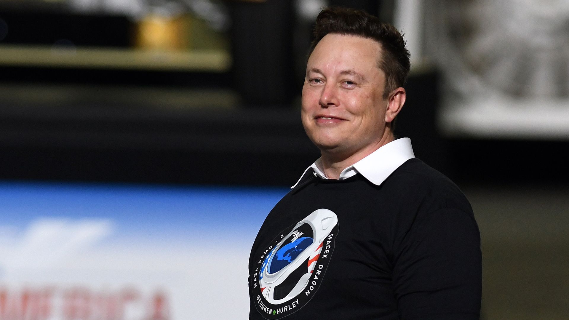 SpaceX founder Elon Musk looks on after being recognized by U.S. President Donald Trump at NASA's Vehicle Assembly Building