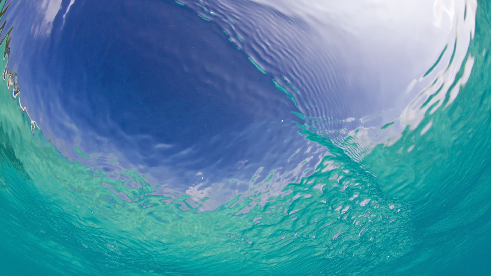 A photograph of the watersurface in turquoise Lagoon, Marshall Islands, Bikini Atoll, Micronesia, Pacific Ocean 