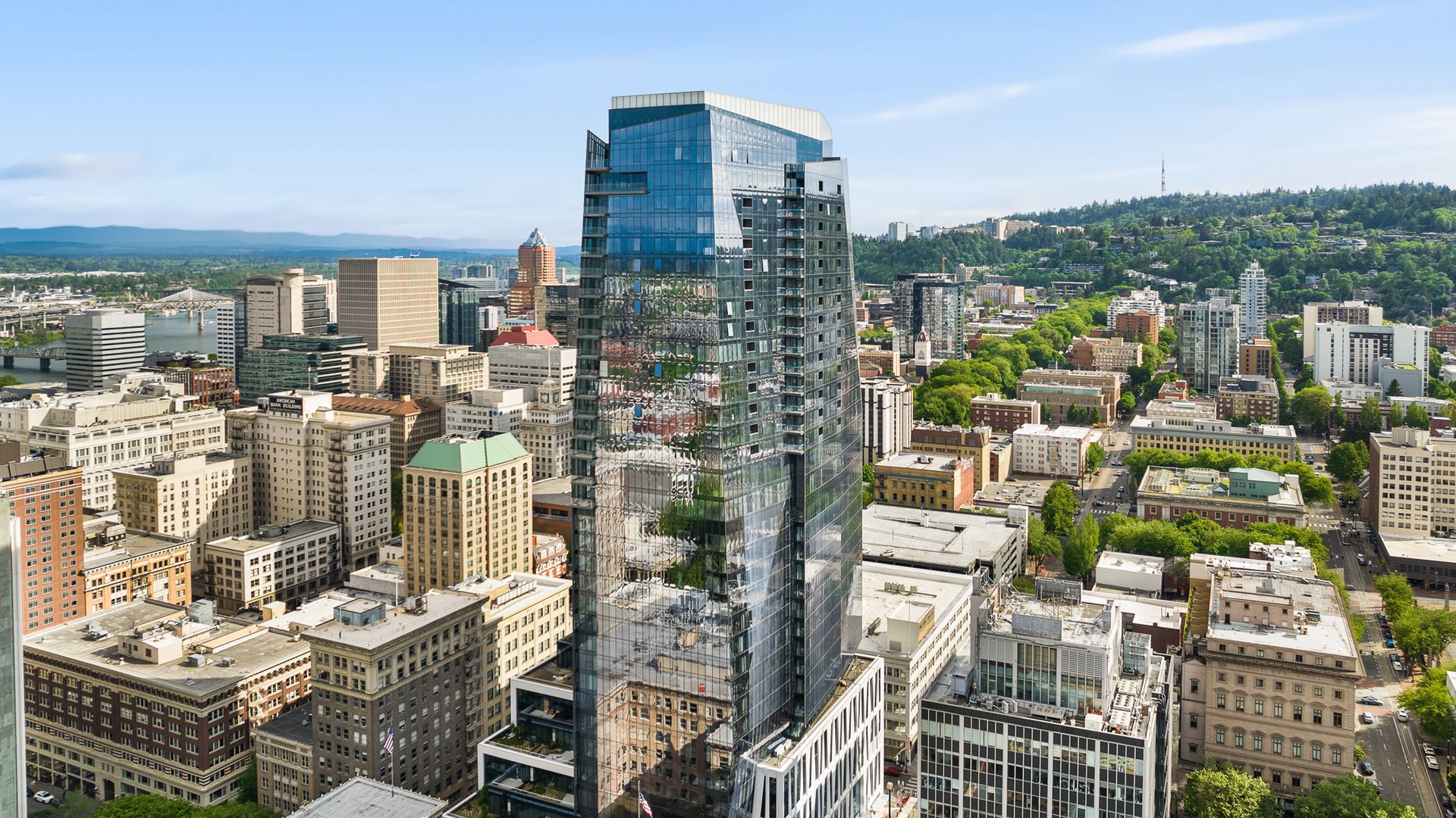 A photo of a building against the Portland skyline.
