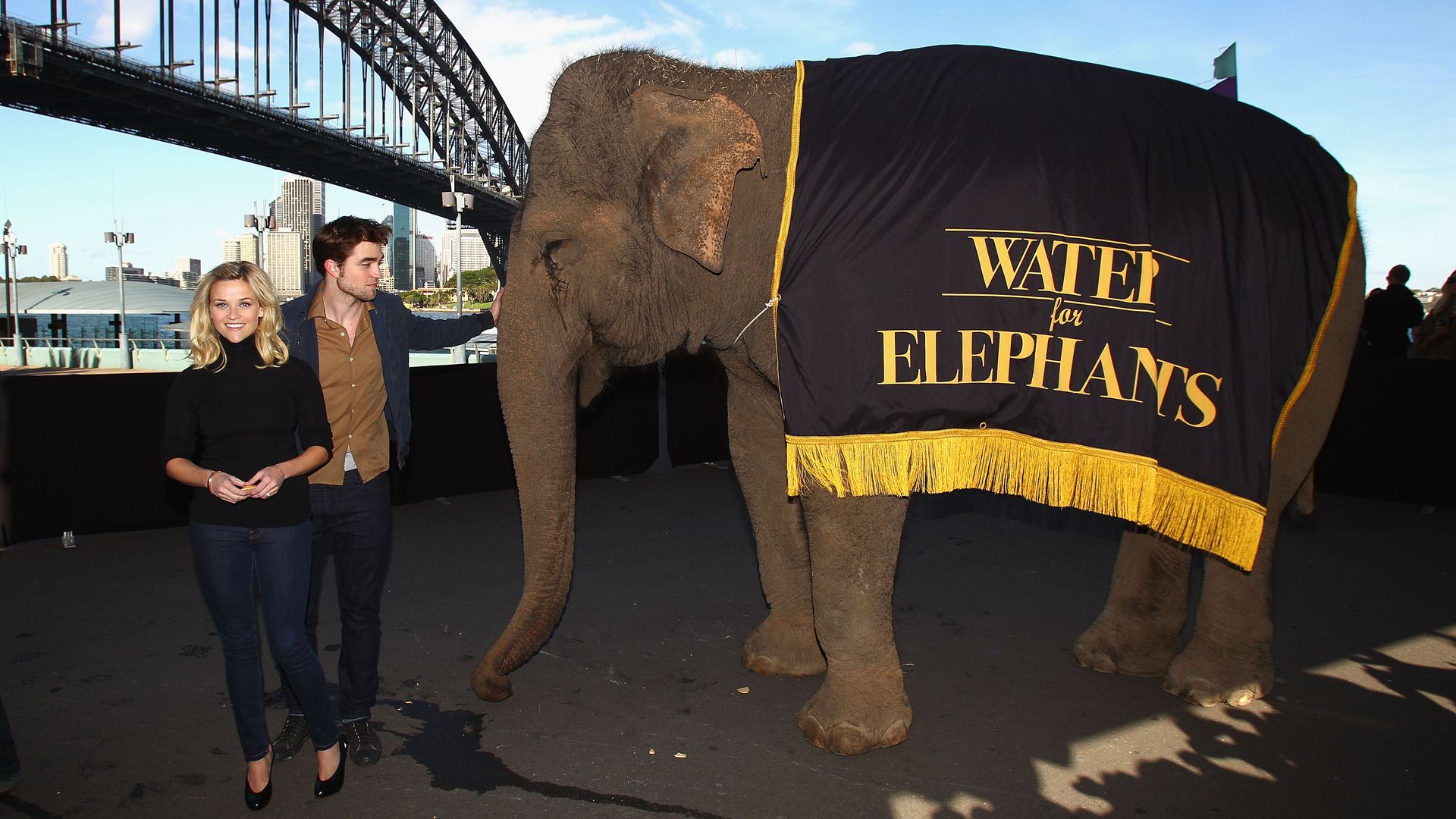 SYDNEY, AUSTRALIA - MAY 06: Reese Witherspoon (L) and Robert Pattinson (R) pose with an Elephant at the "Water For Elephants" press conference at Luna Park on May 6, 2011 in Sydney, Australia. (Photo by Ryan Pierse/Getty Images)
