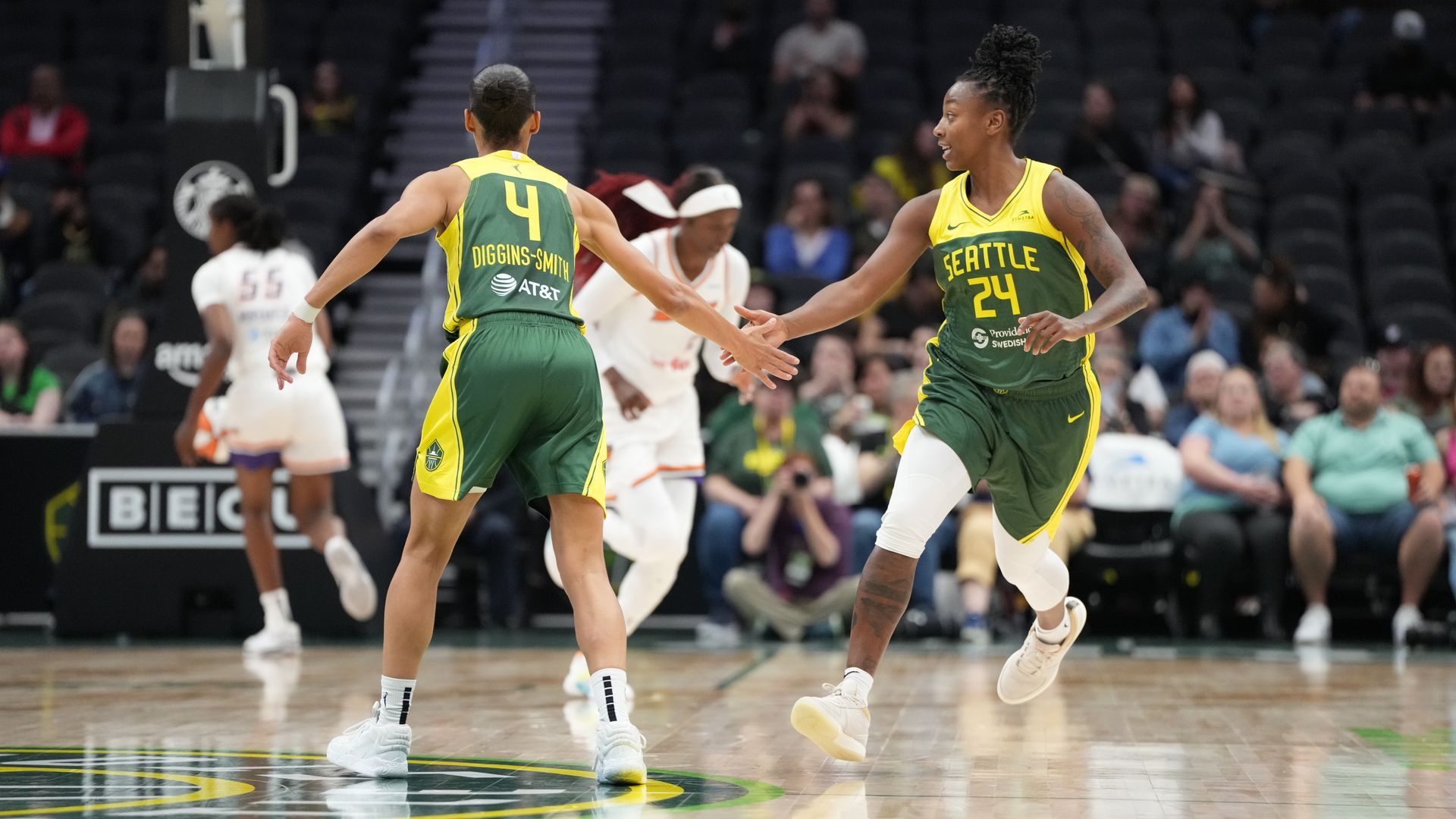 Seattle Storm players on the court during a game. 