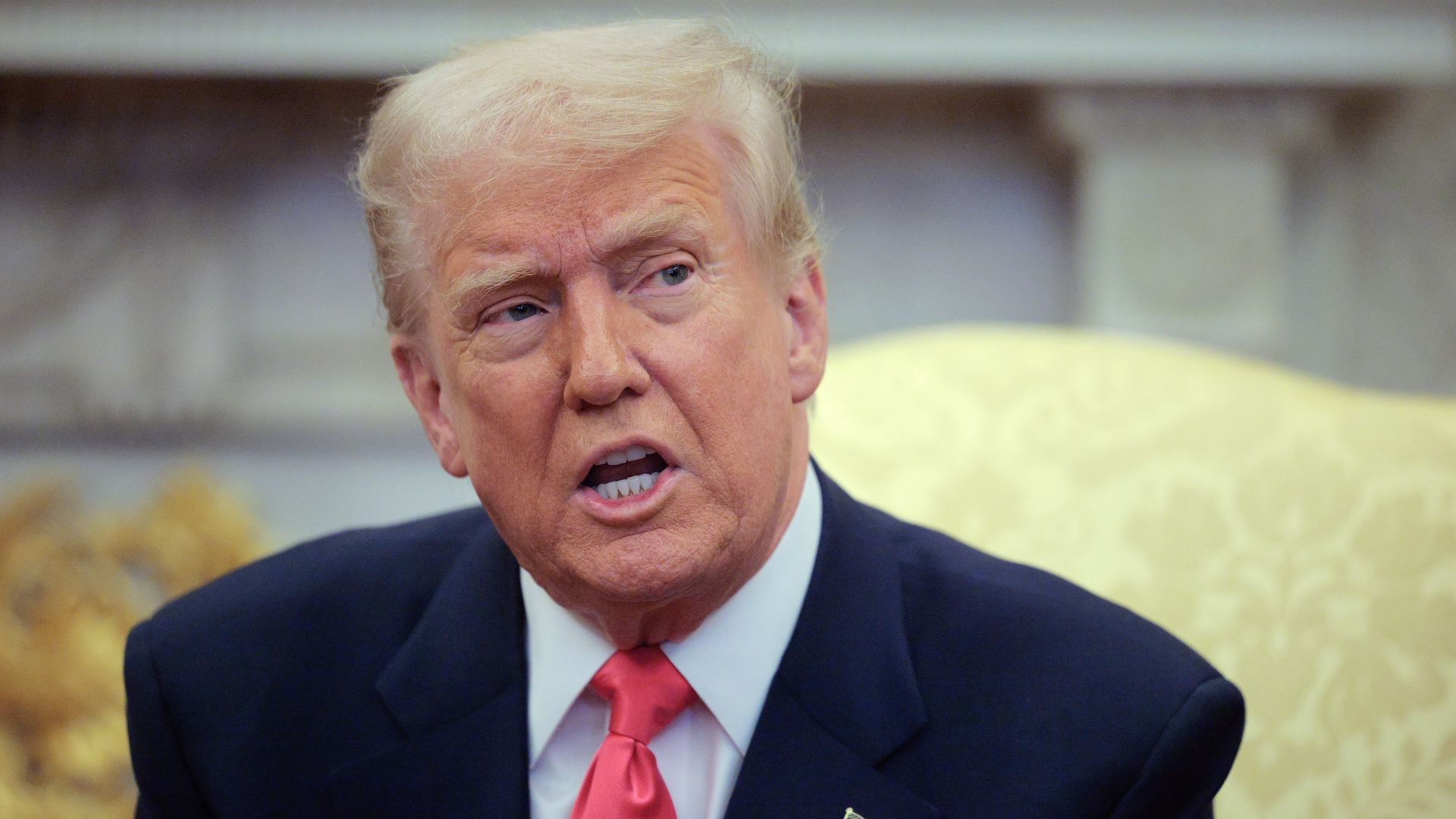 President Trump answers reporters' questions in the Oval Office on March 12. 