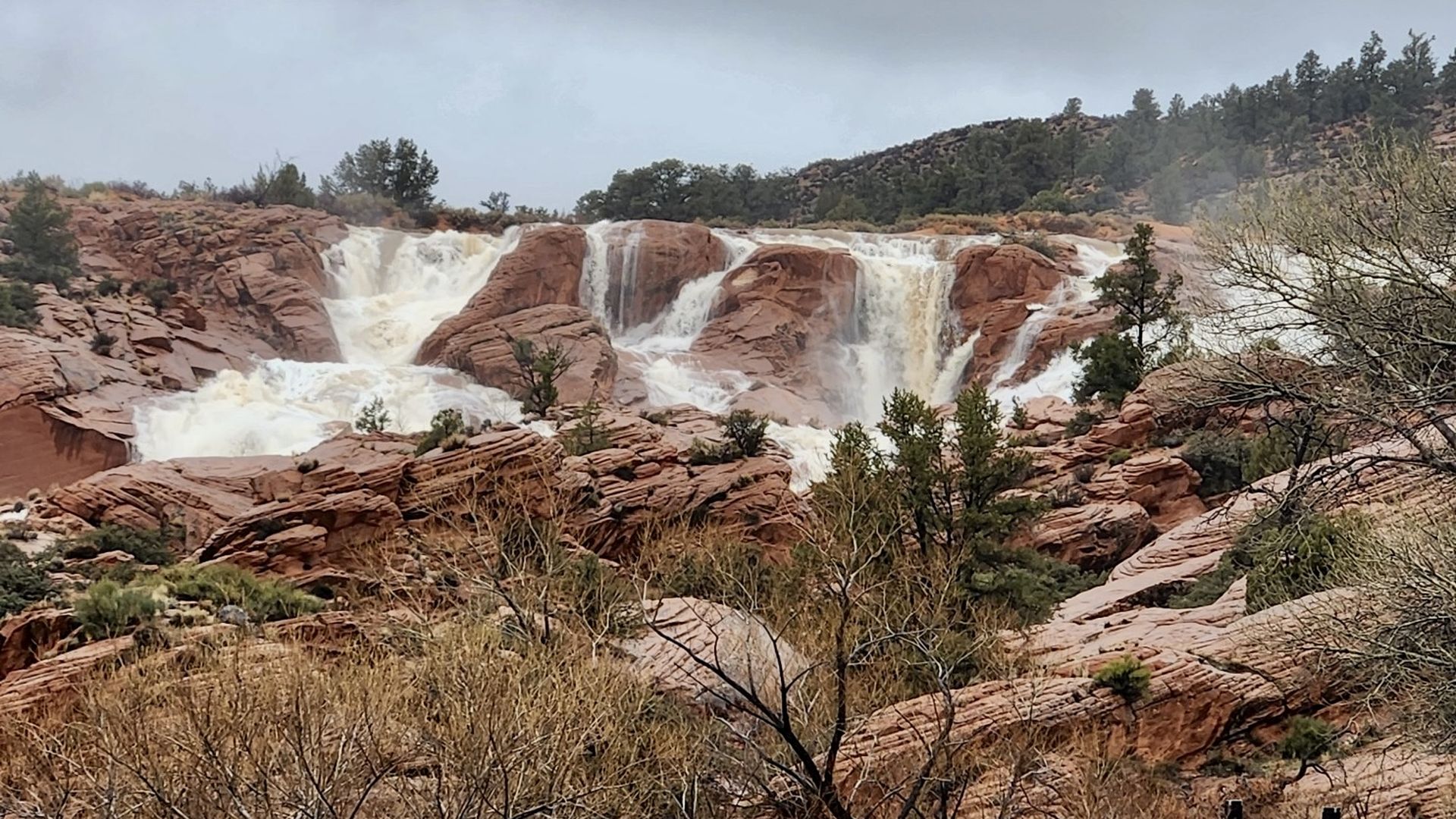 Waterfalls over red rock