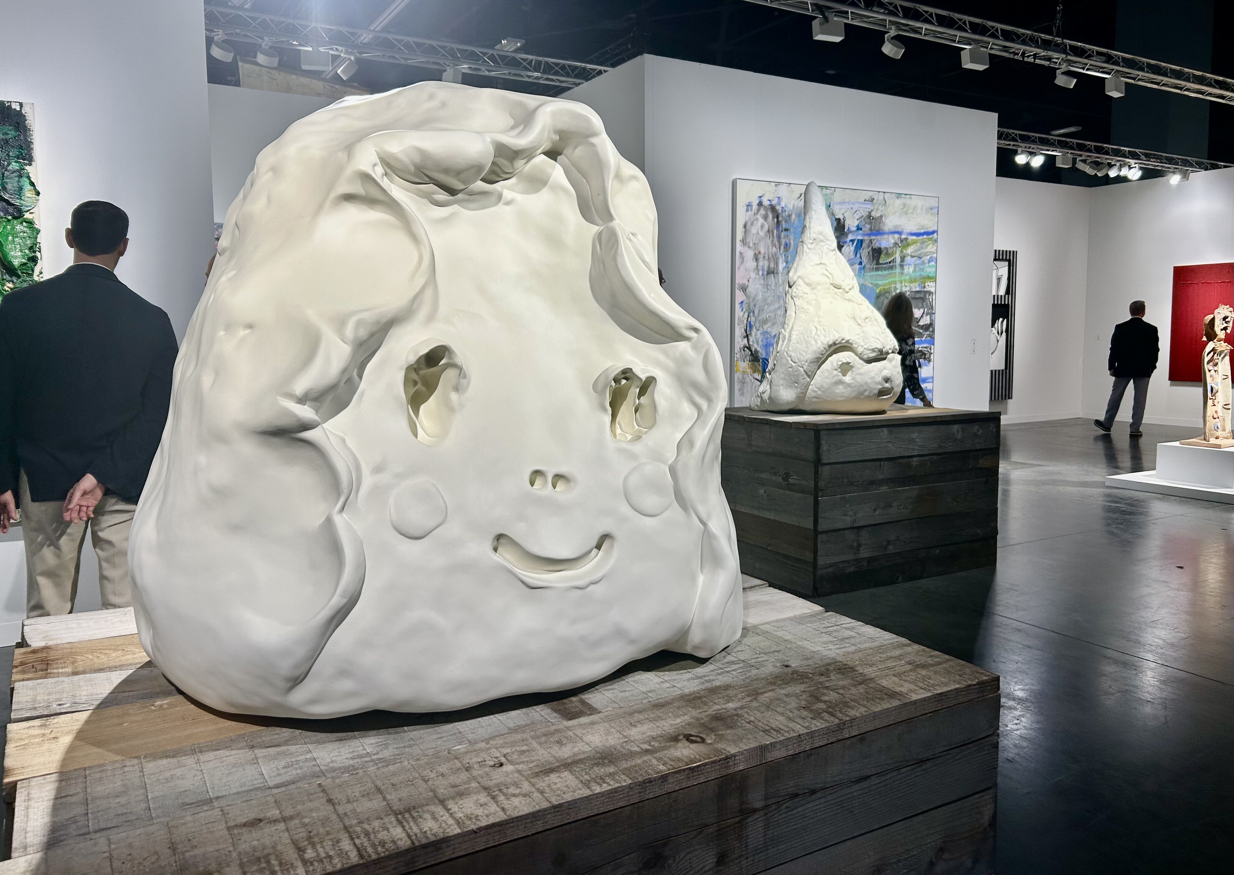A sculpture with a smiley face at Art Basel. 