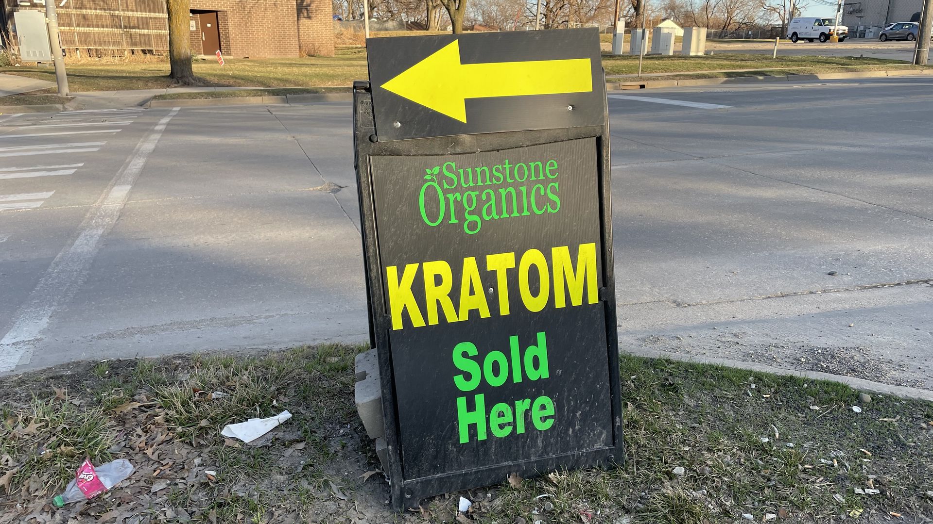 A sign advertising kratom outside a Des Moines convenience store.