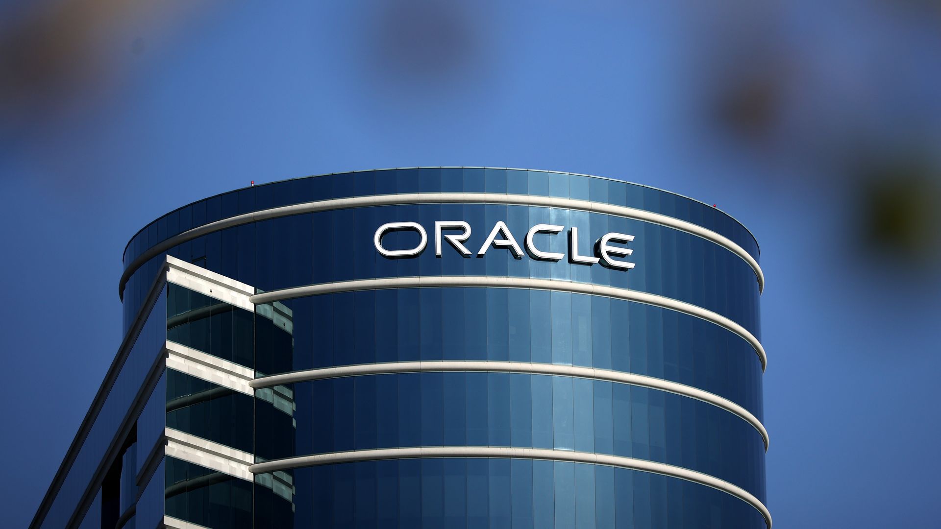 White Oracle name on a blue headquarters building.