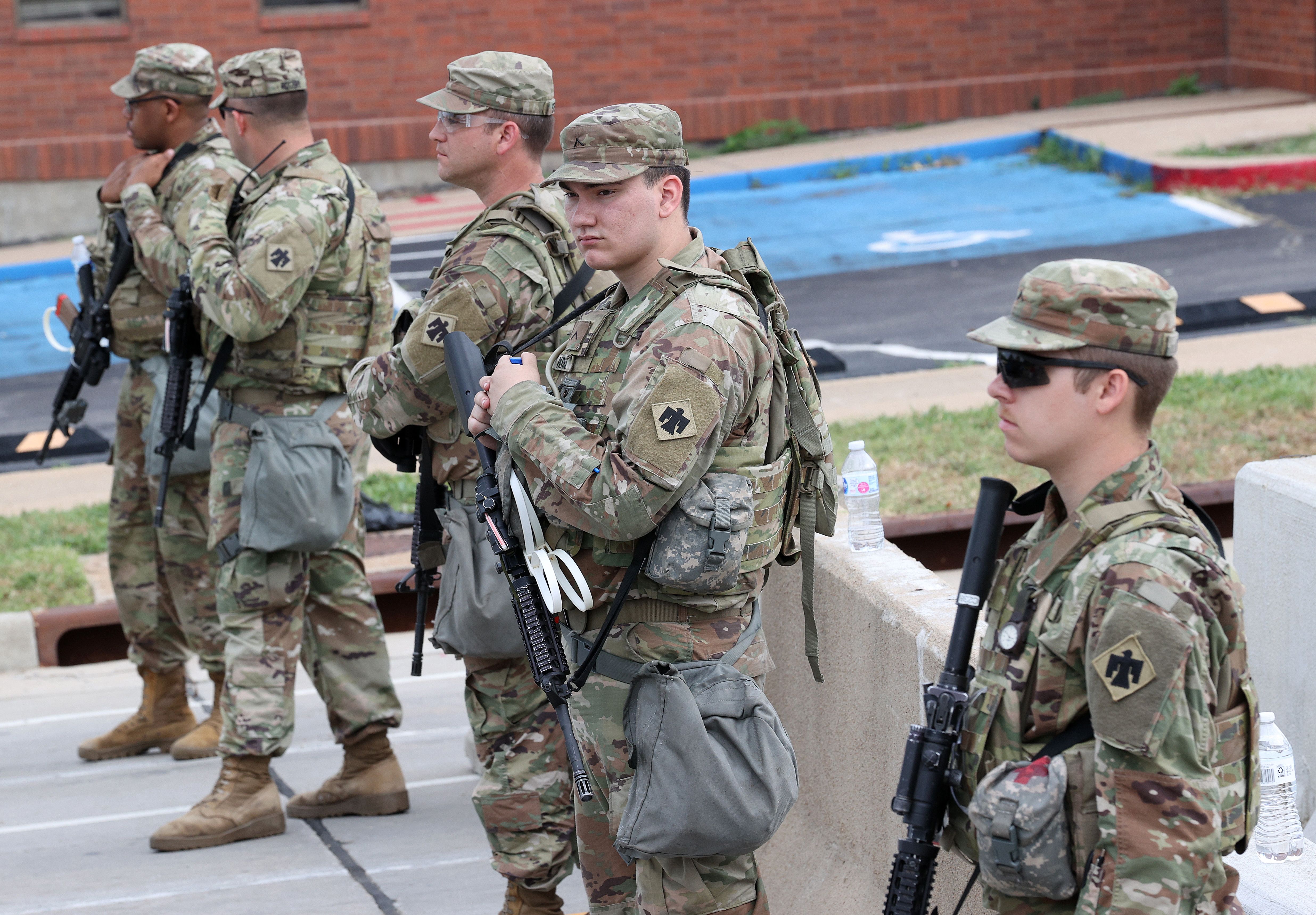 National guard soldiers stand in a line