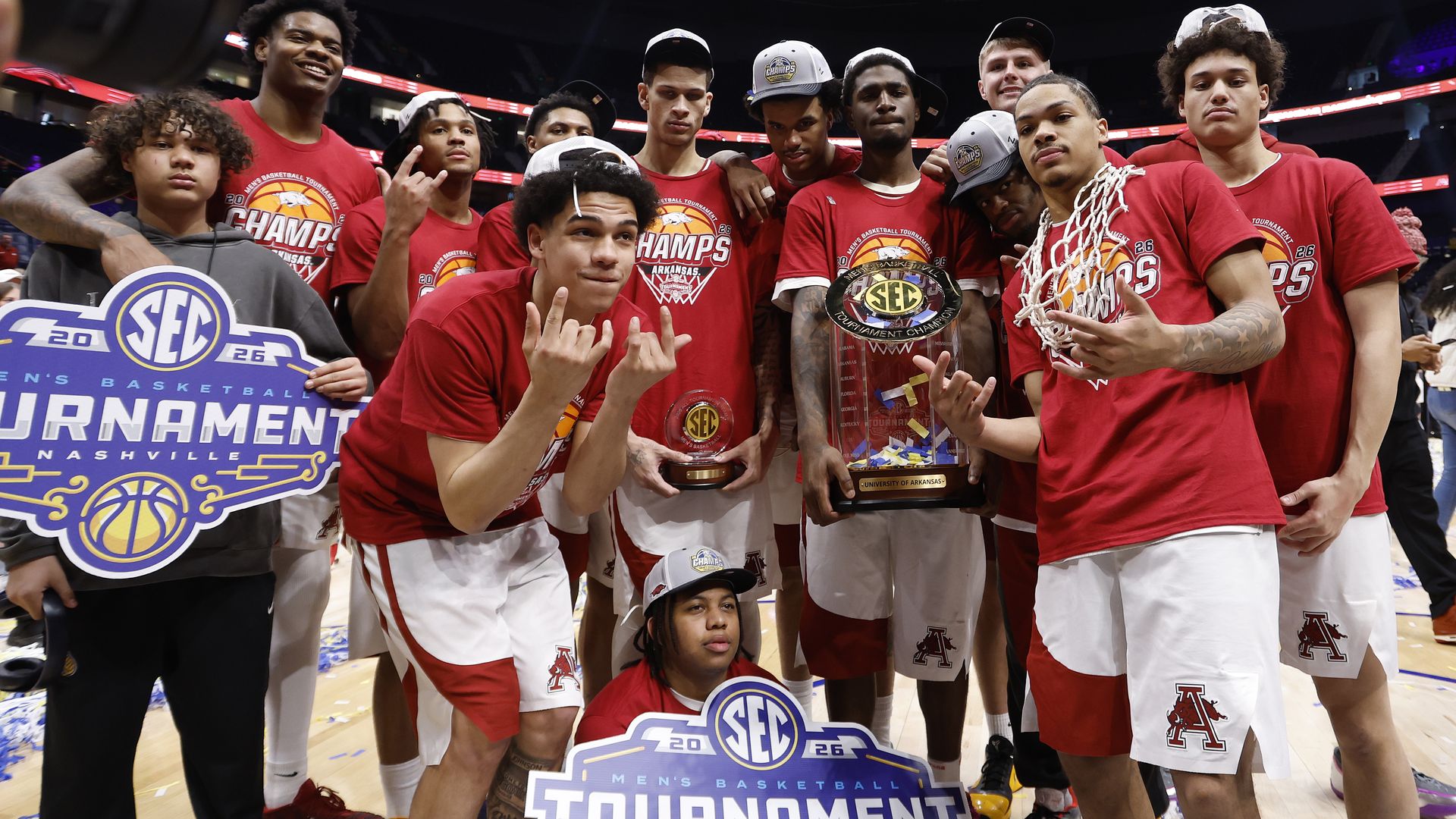 The Arkansas Razorbacks celebrate after defeating the Vanderbilt Commodores 86-75 in the 2026 SEC Men's Basketball Tournament Championship game at Bridgestone Arena on March 15, 2026 in Nashville, Tennessee.
