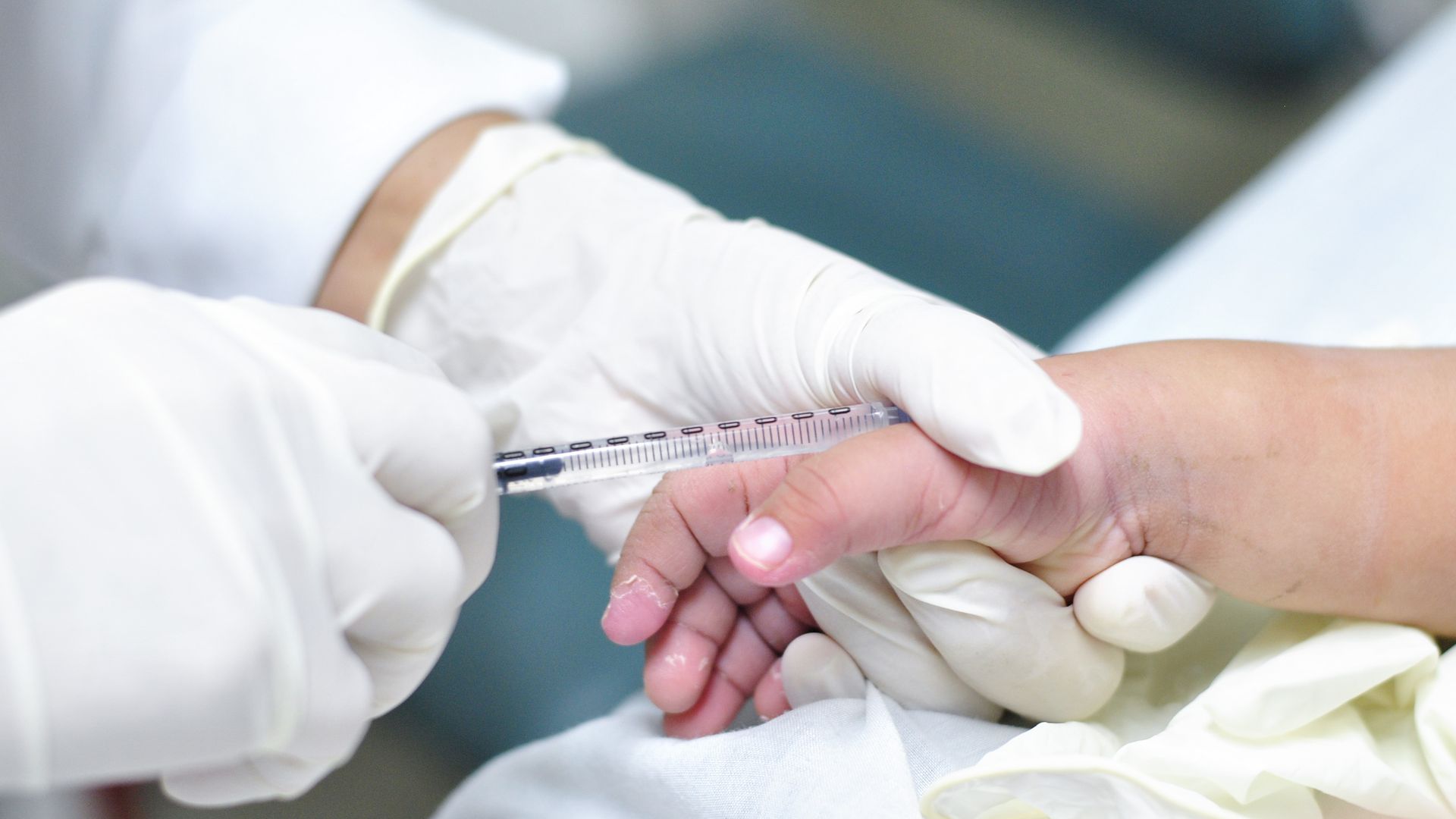 A patient gets medicine intravenously.