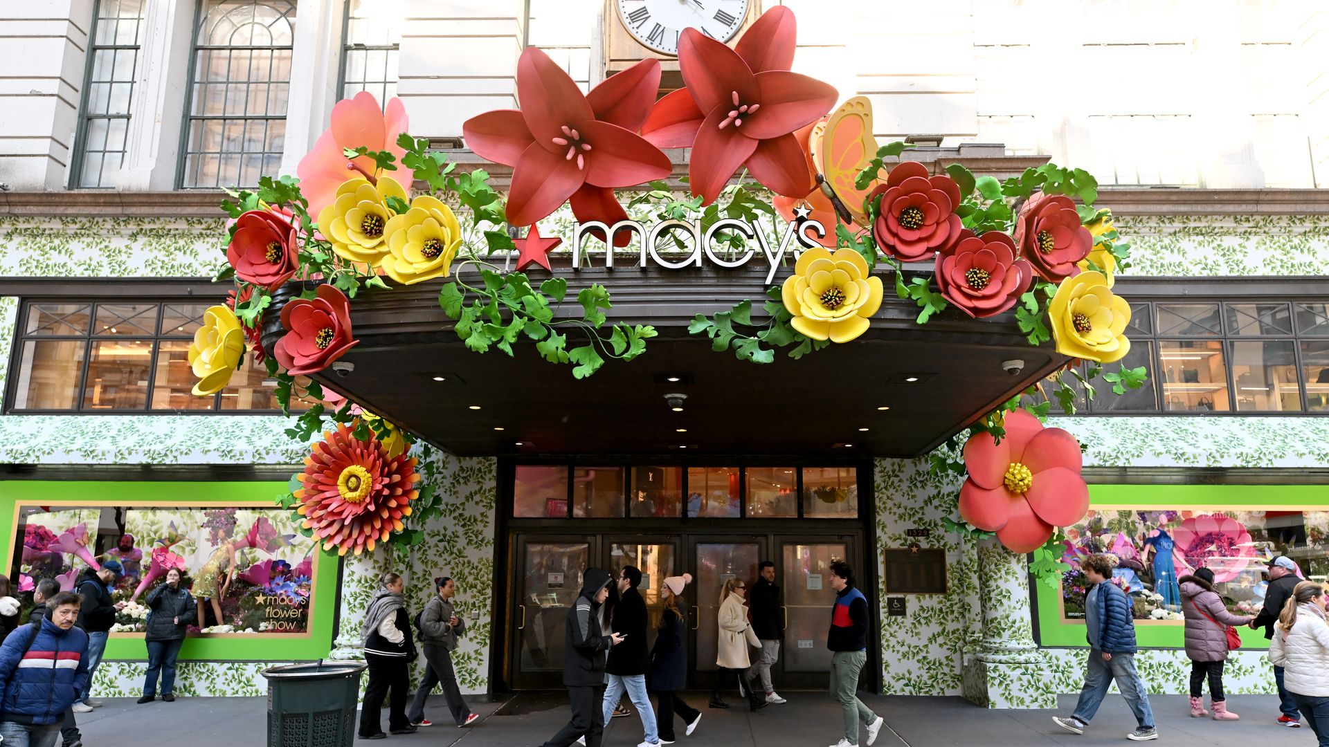 Entrance to Macy's department store, covered in flowers.