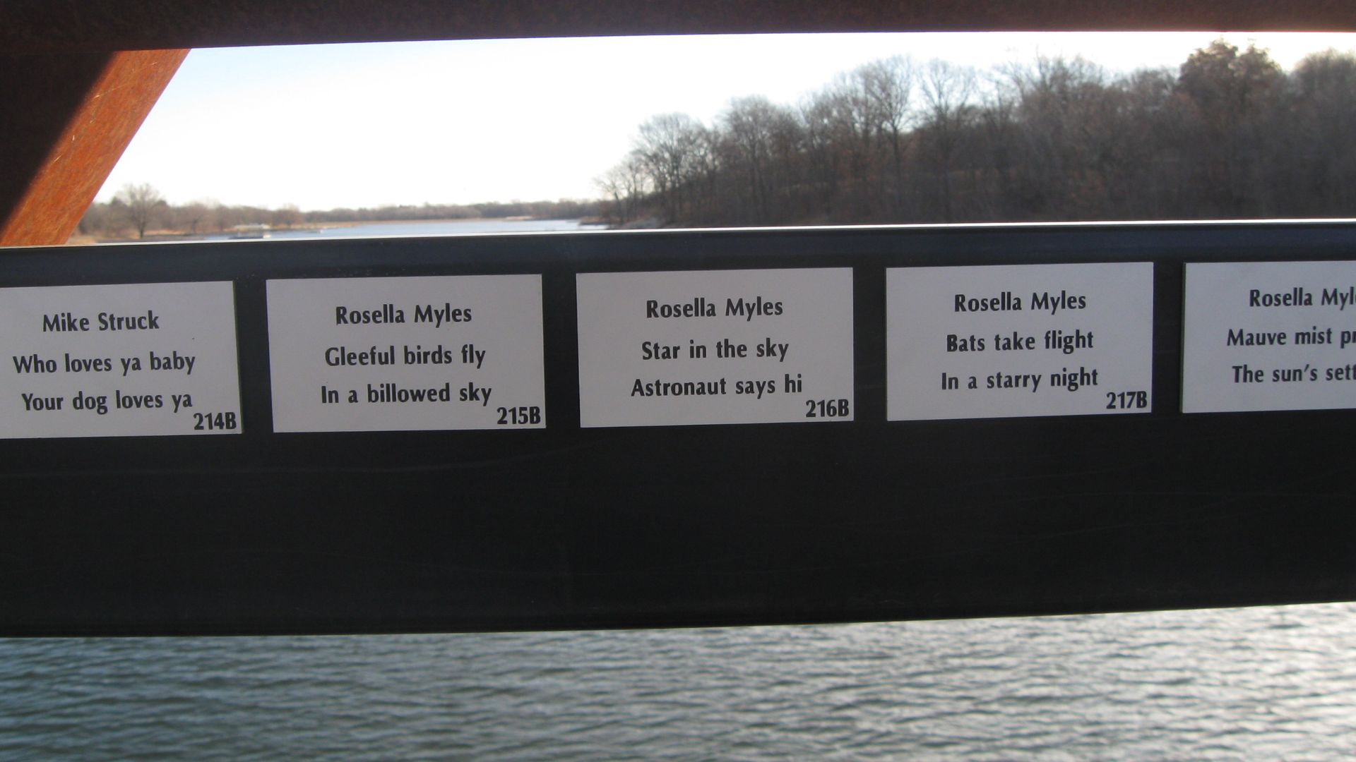 A photo of plaques on a Des Moines bridge