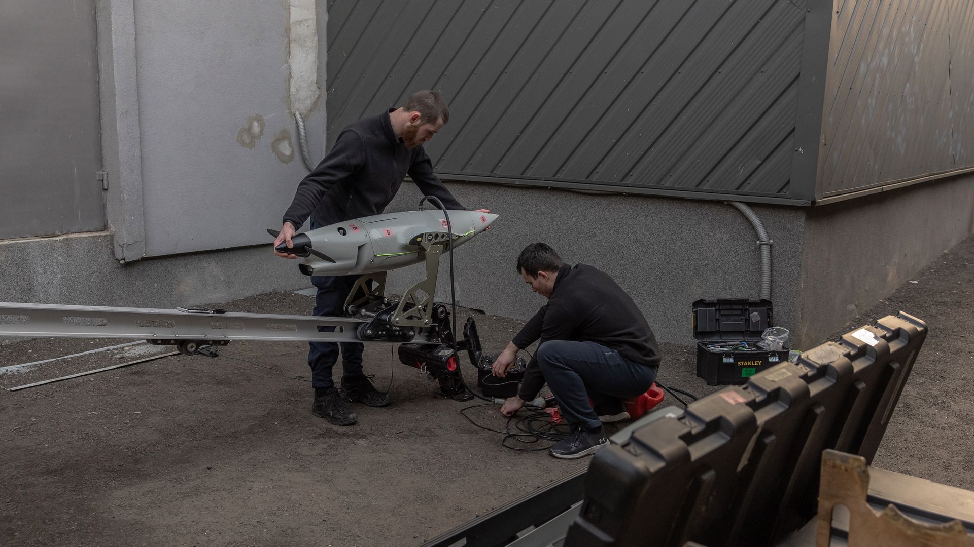 Employees work on a Raybird long-range surveillance drone at the Skyeton drone-manufacturing company, in the Kyiv region, on February 27, 2024, amid the Russian invasion of Ukraine. Skyeton is a drone-manufacturing hub for the Ukrainian armed forces, churning out unmanned aerial vehicles (UAVs) to s