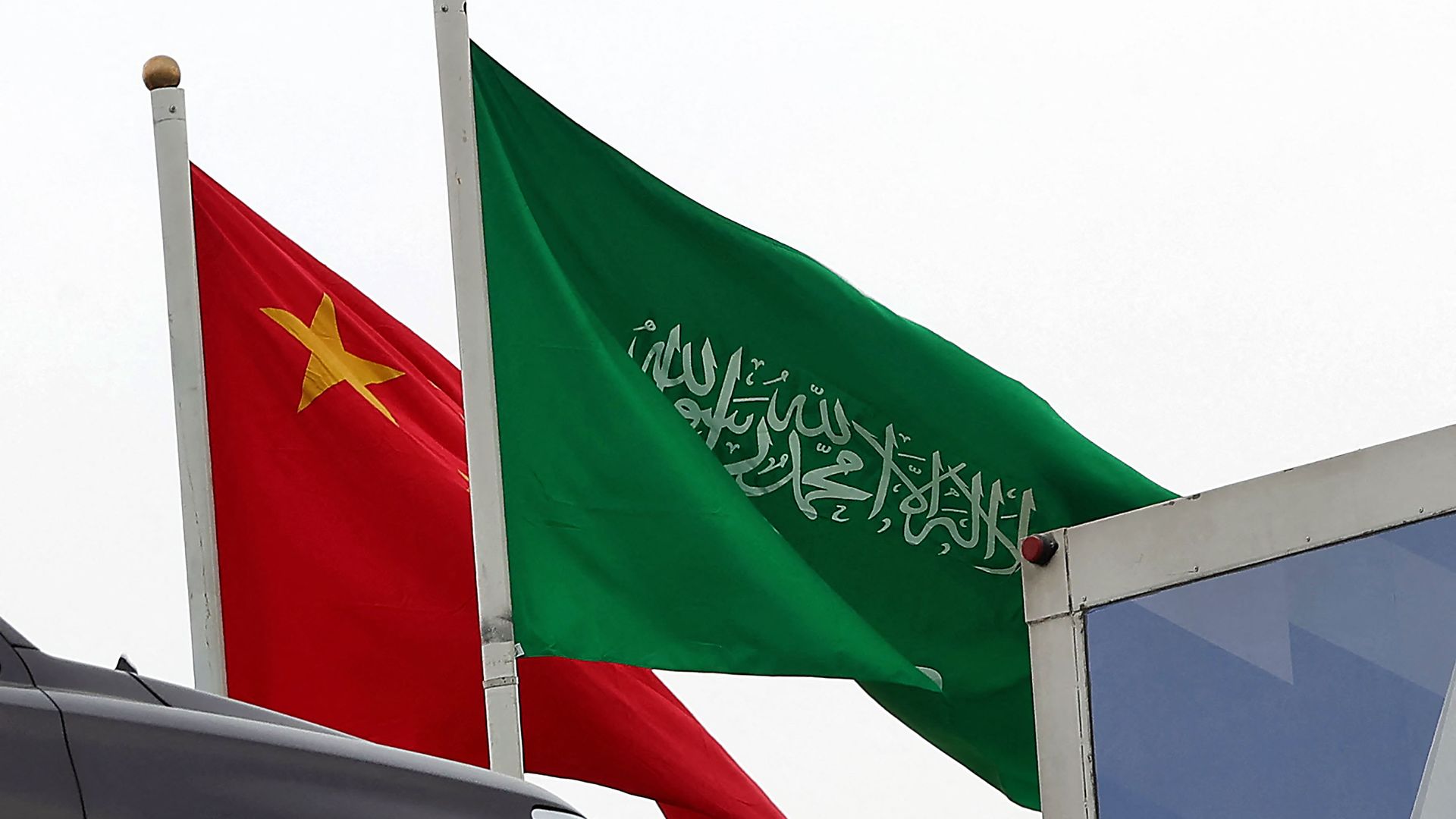 A picture taken on December 7, 2022 in Riyadh, shows the Chinese and the Saudi flags adorning a street ahead of the Chinese president's visit to the Saudi capital.