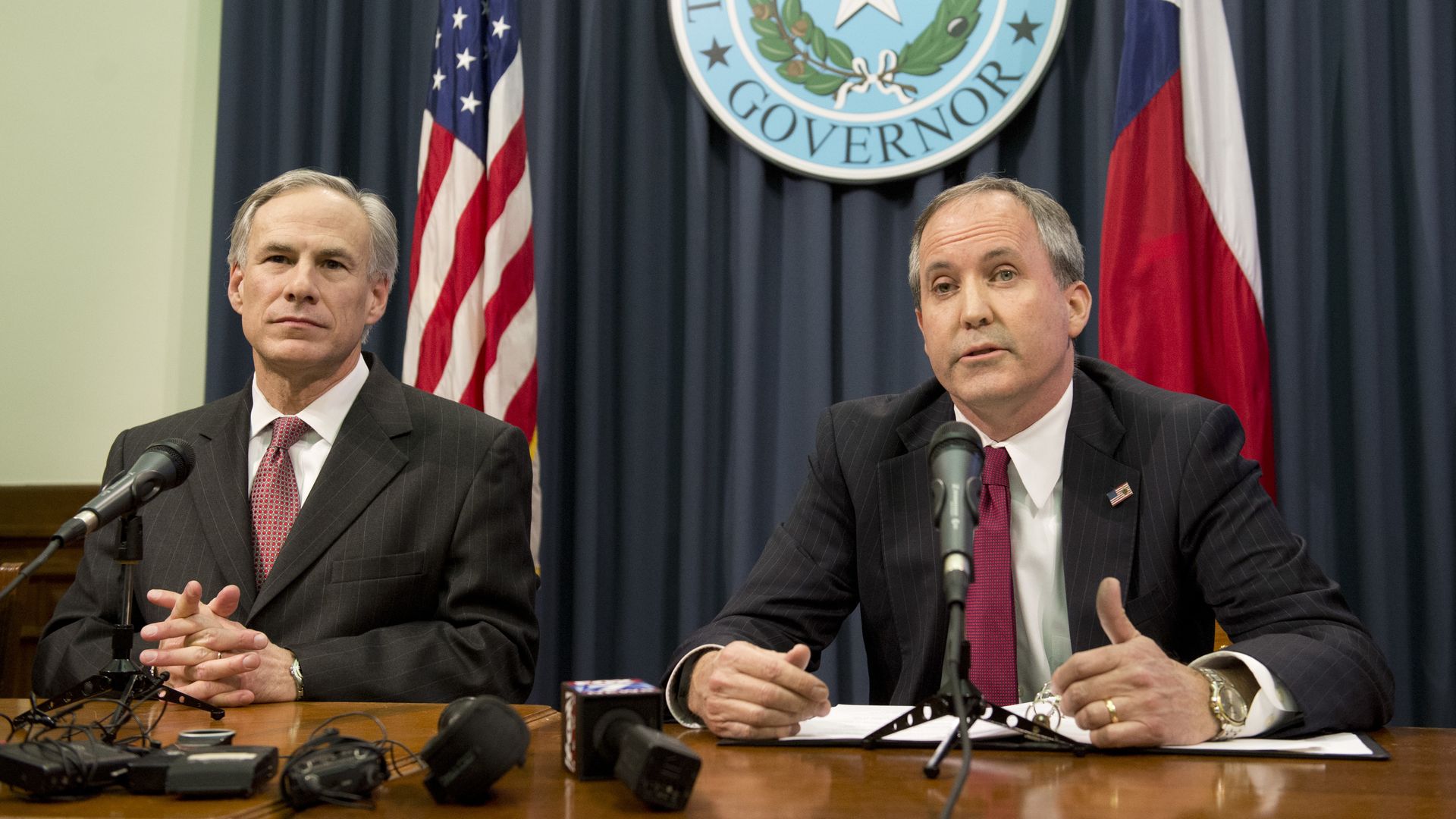  Texas Gov. Greg Abbott, l, and Attorney General Ken Paxton hold a press conference in 2015