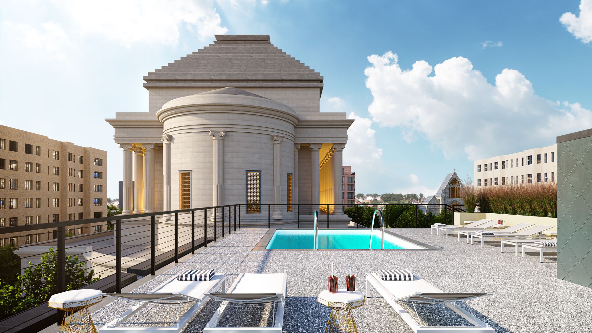 The rooftop with a view of the Scottish Rite Masonic Temple, with a pool and lounge chairs.