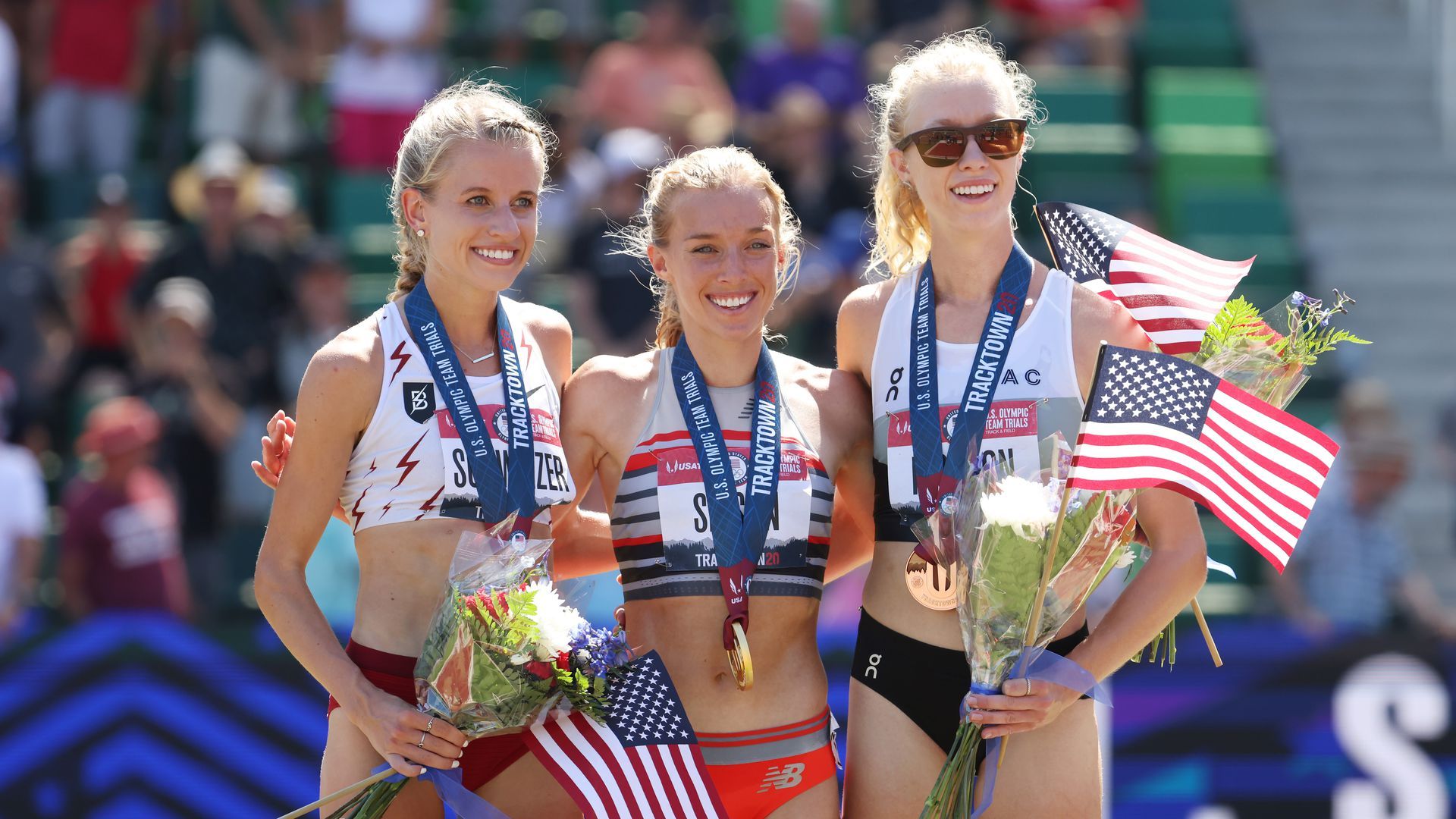 Karissa Schweizer, Emily Sisson and Alicia Monson, pose for a photo with their medals after the Women's 10,000 Meters Final at Hayward Field in Eugene, Oregon.