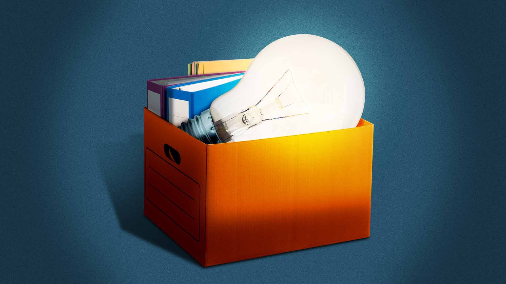 Illustration of a lit lightbulb in a cardboard box of office items