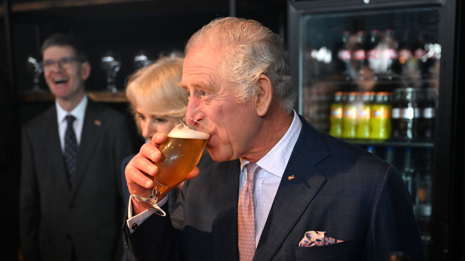 King Charles drinking a beer.