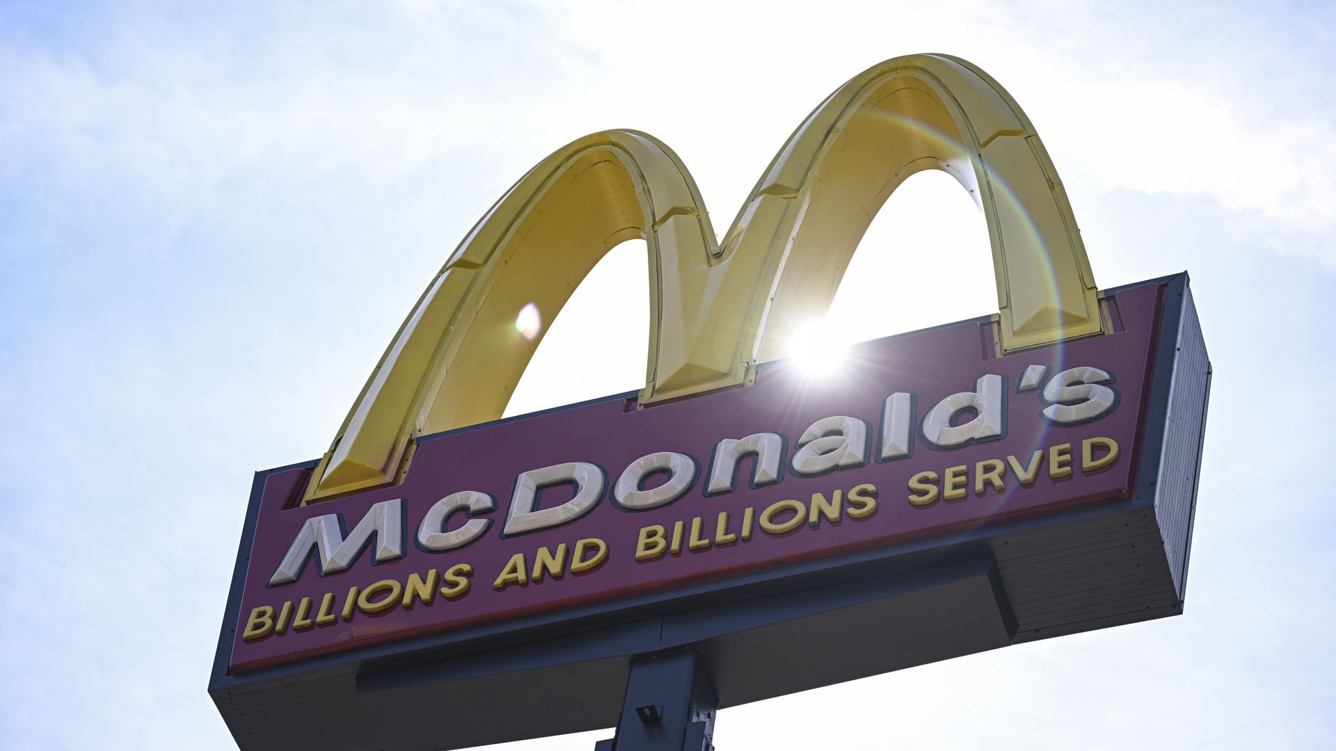 McDonald's golden arches sign that says "McDonald's billions and billions served"
