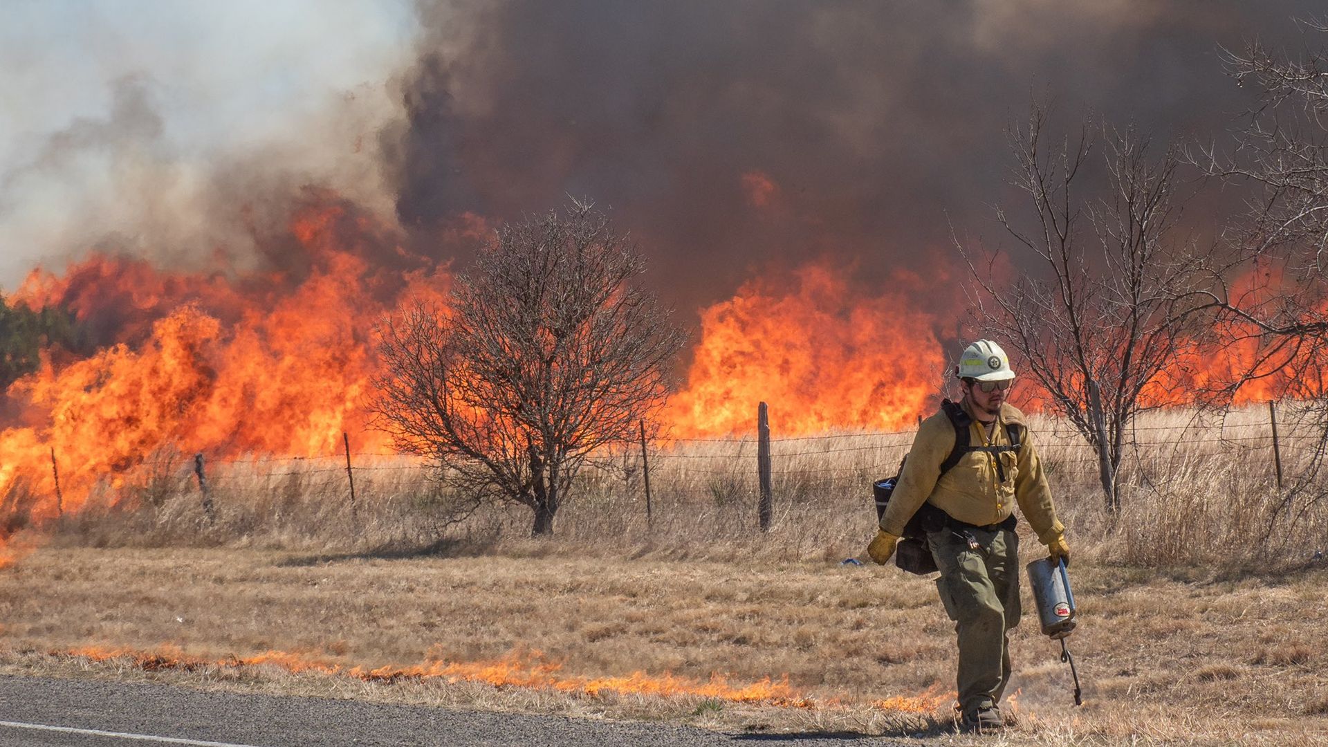 A firefighter utilizes a drip torch during a tactical firing operation on March 15, 2022 in Runnels County.