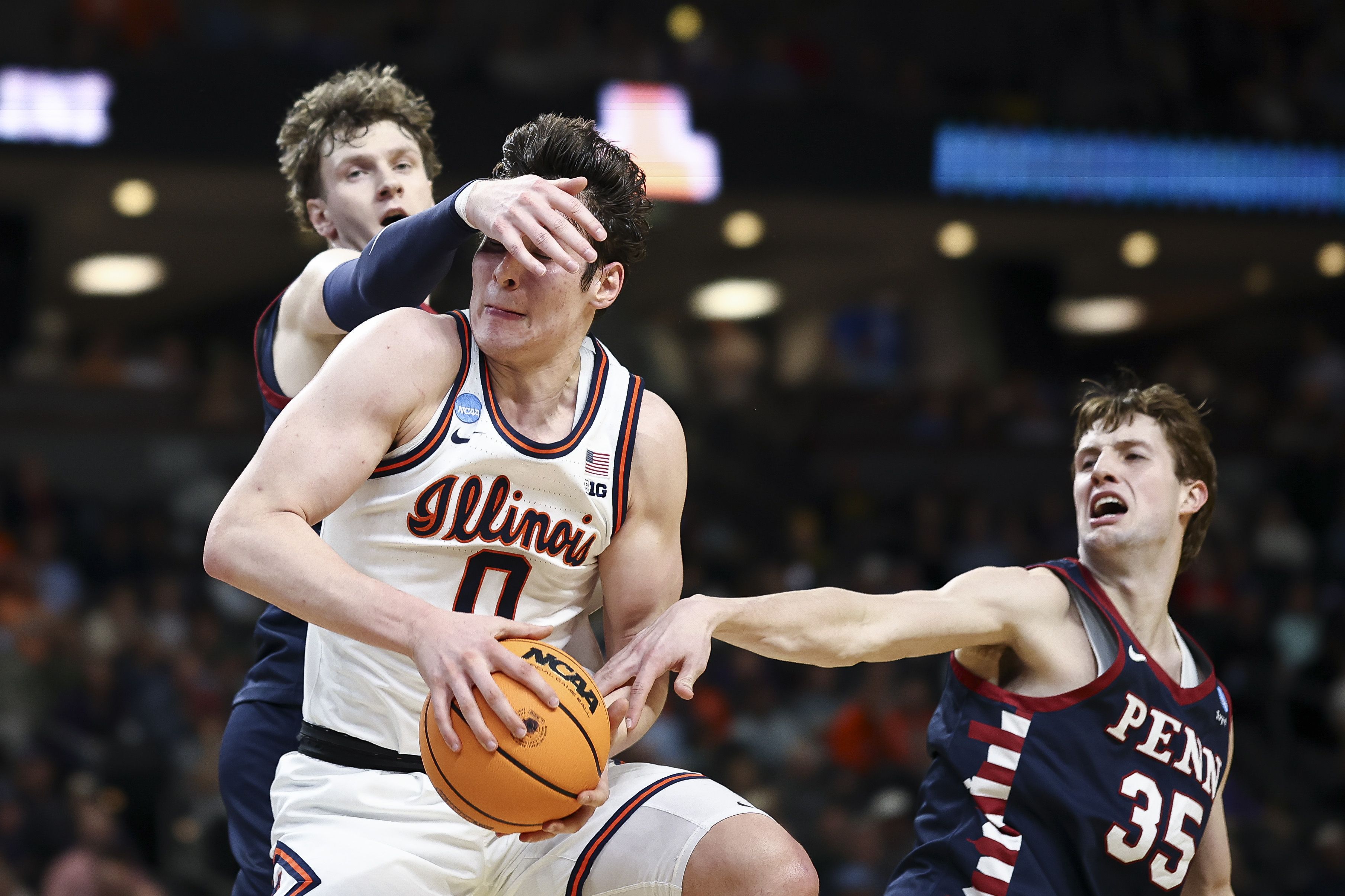 David Mirkovic of Illinois is fouled by TJ Power of Penn. Photo: Jared C. Tilton/Getty Images